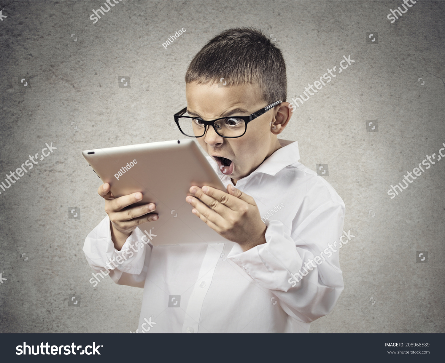 stock-photo-closeup-portrait-child-shocked-surprised-funny-looking-boy-with-glasses-using-holding-laptop-208968589.jpg
