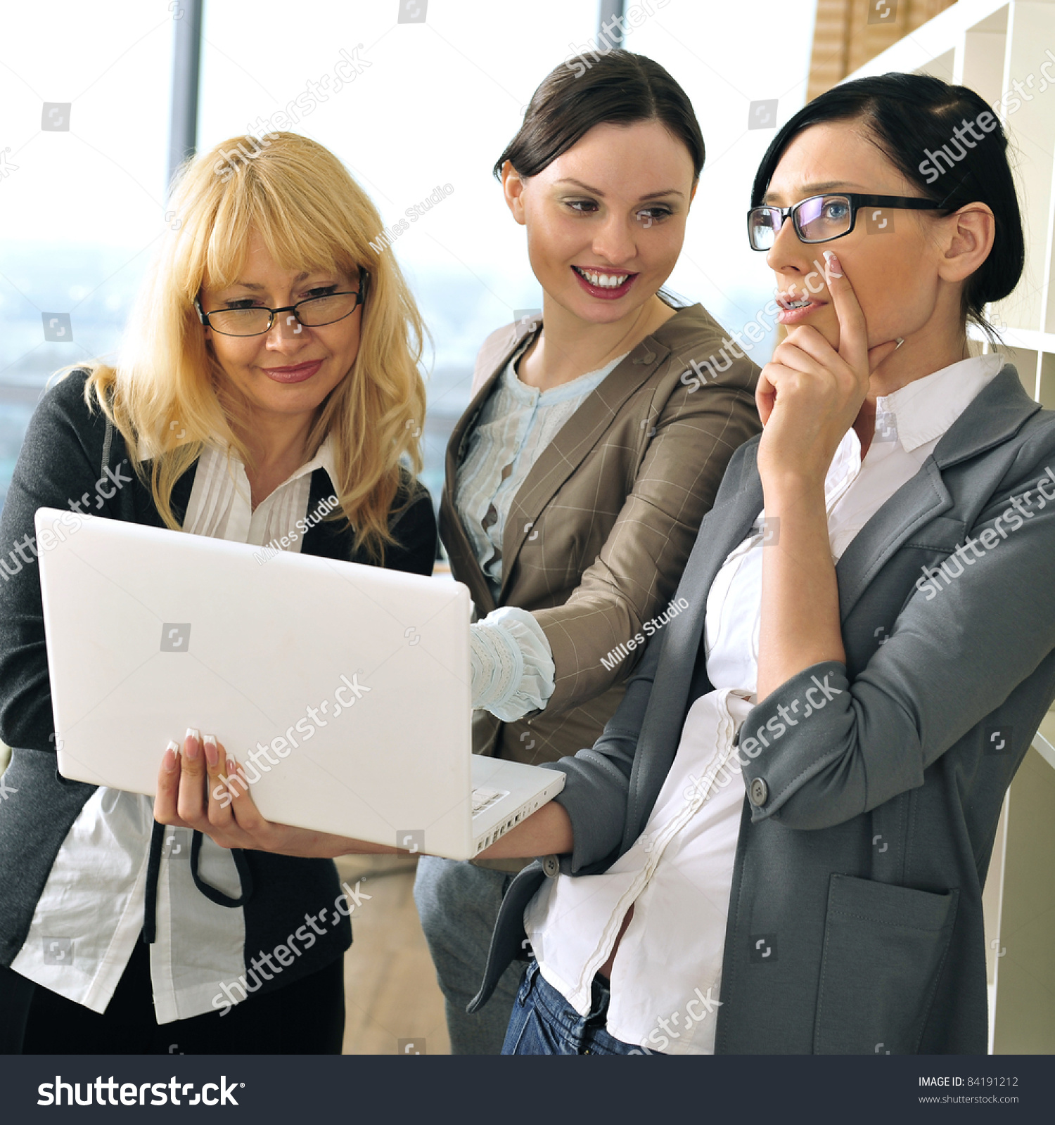 Closeup Portrait Of Three Women Working Indoor Together With Documents ...