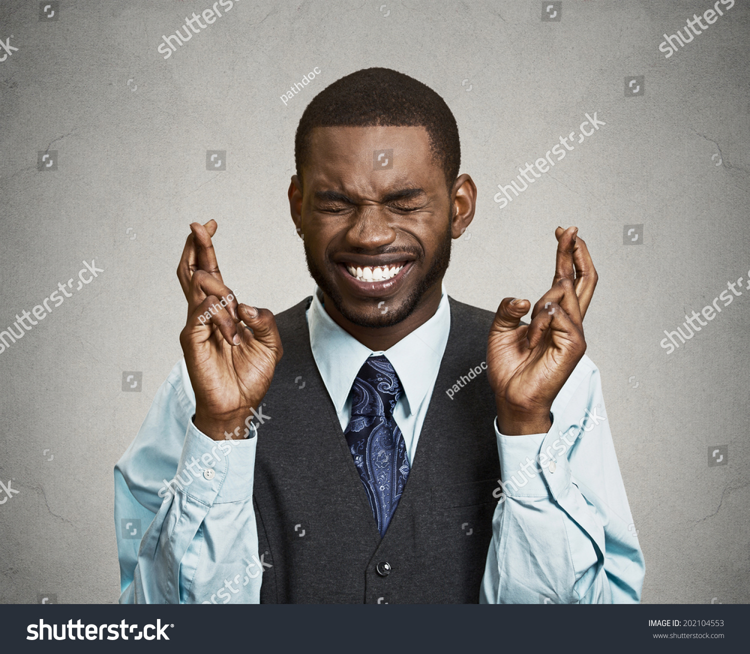 stock-photo-closeup-portrait-young-funny-guy-business-man-crossing-fingers-wishing-hoping-for-best-miracle-202104553.jpg