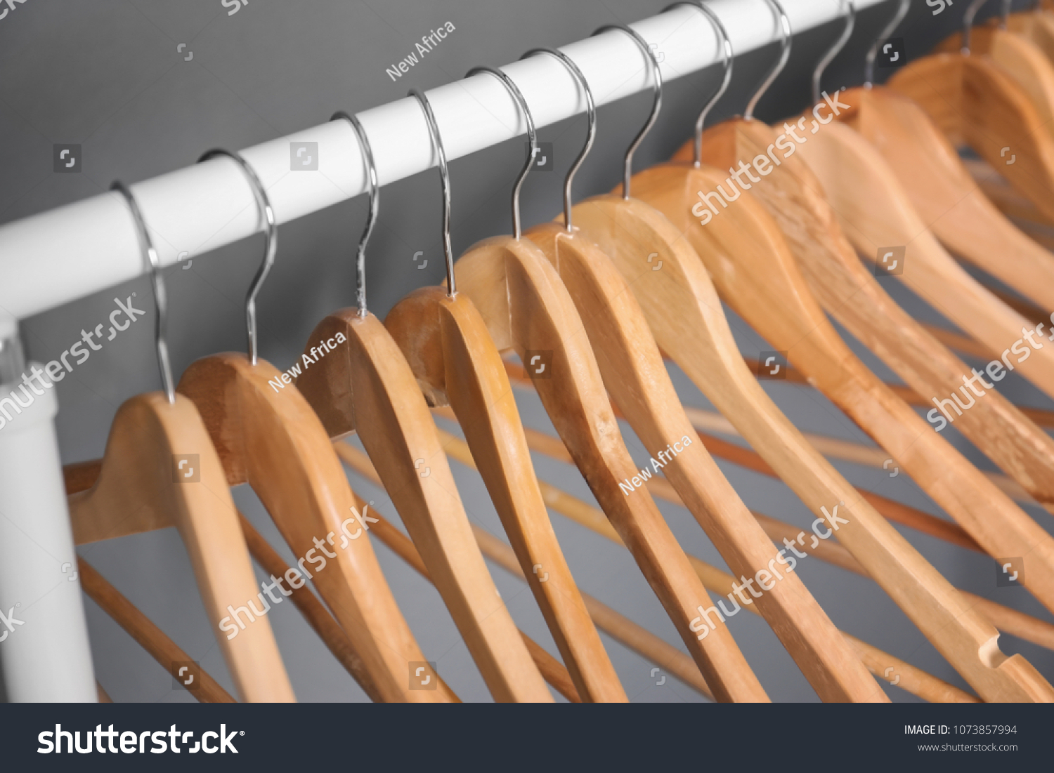 gray wooden hangers