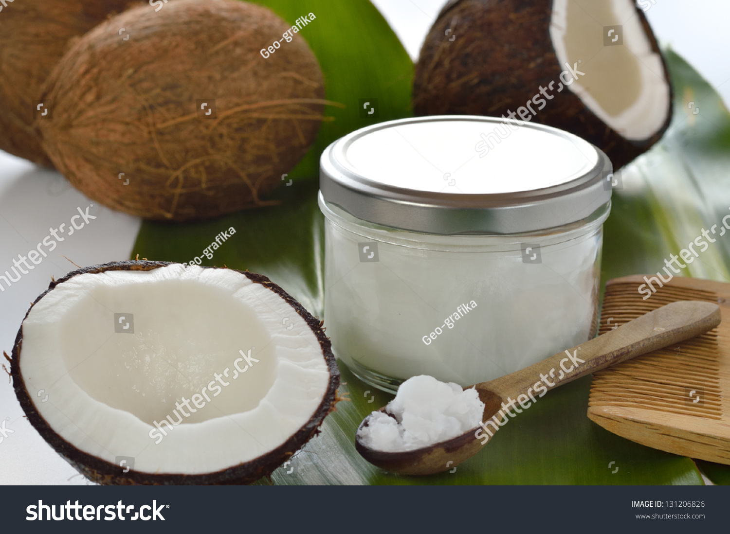 Coconuts And Organic Coconut Oil In A Glass Jar On White Background ...