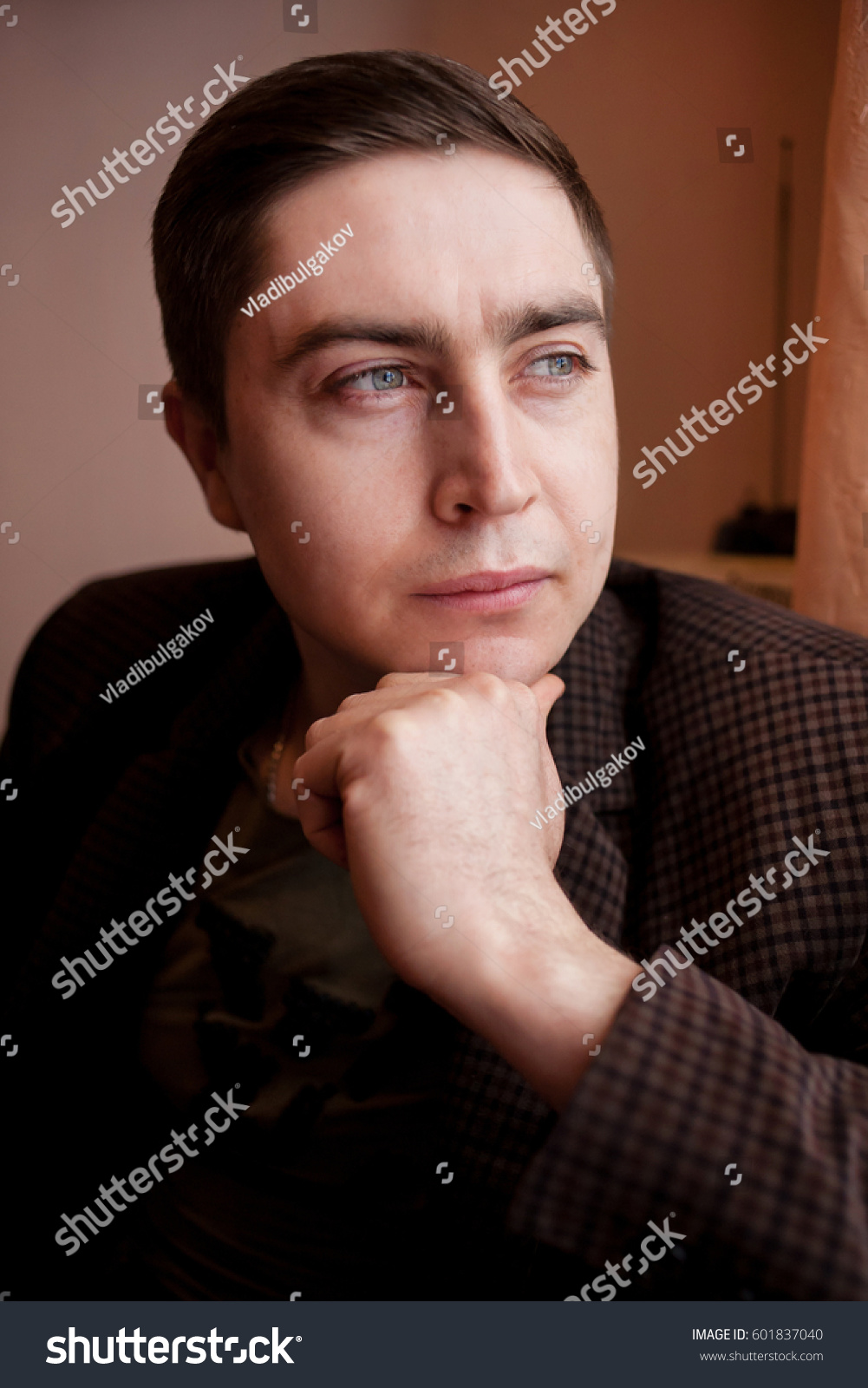 Color portrait of a pensive man portrait of a man close up