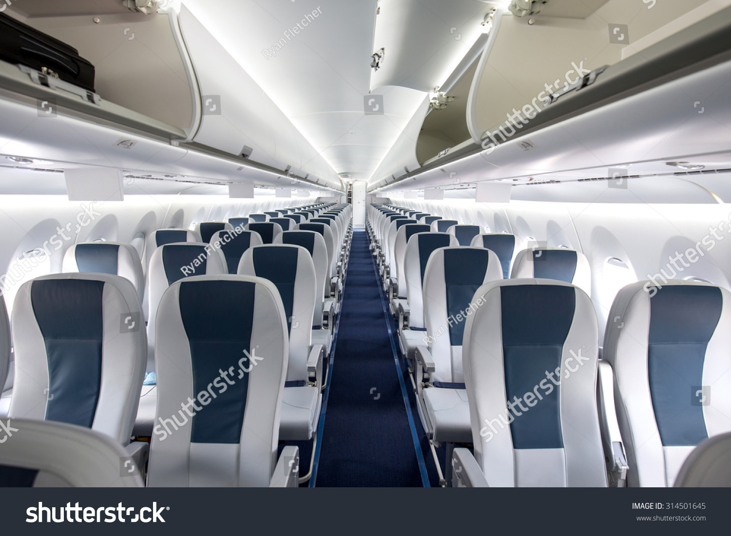 Commercial Aircraft Cabin With Rows Of Seats Down The Aisle Stock Photo ...