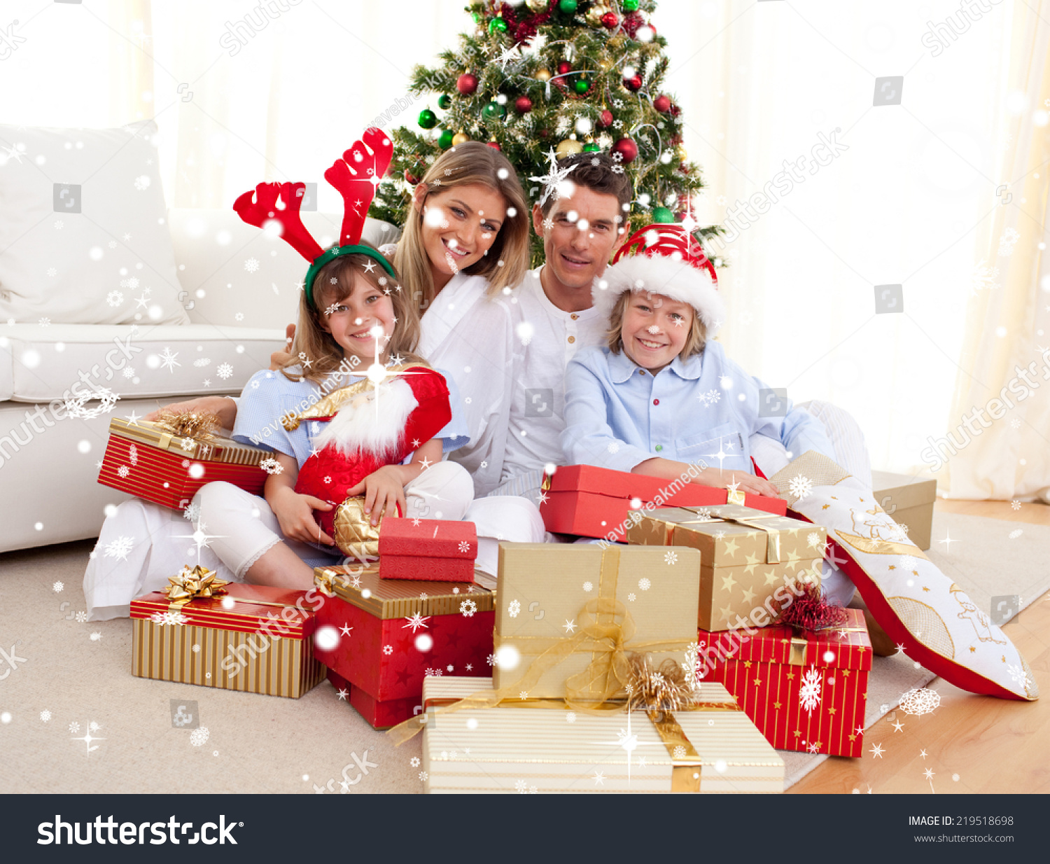 composite image happy family holding christmas stock photo composite image happy family holding christmas stock photo