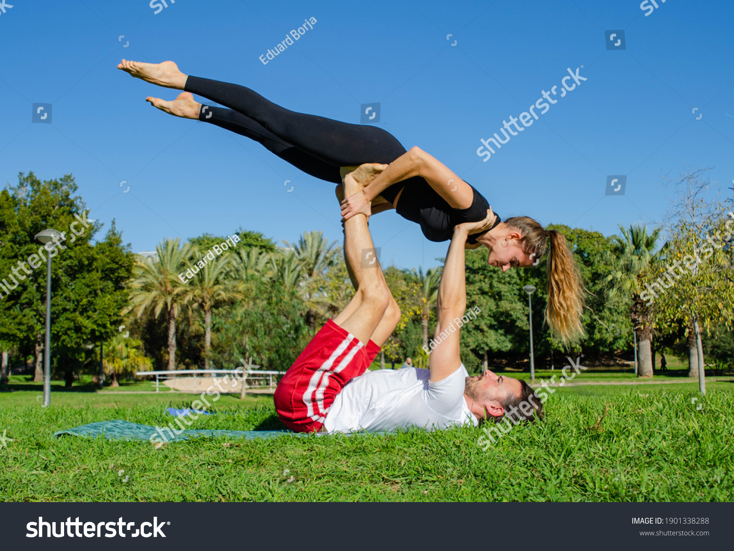 Concentrated Gymnast Couple Doing Equilibrium Pose Stock Photo ...