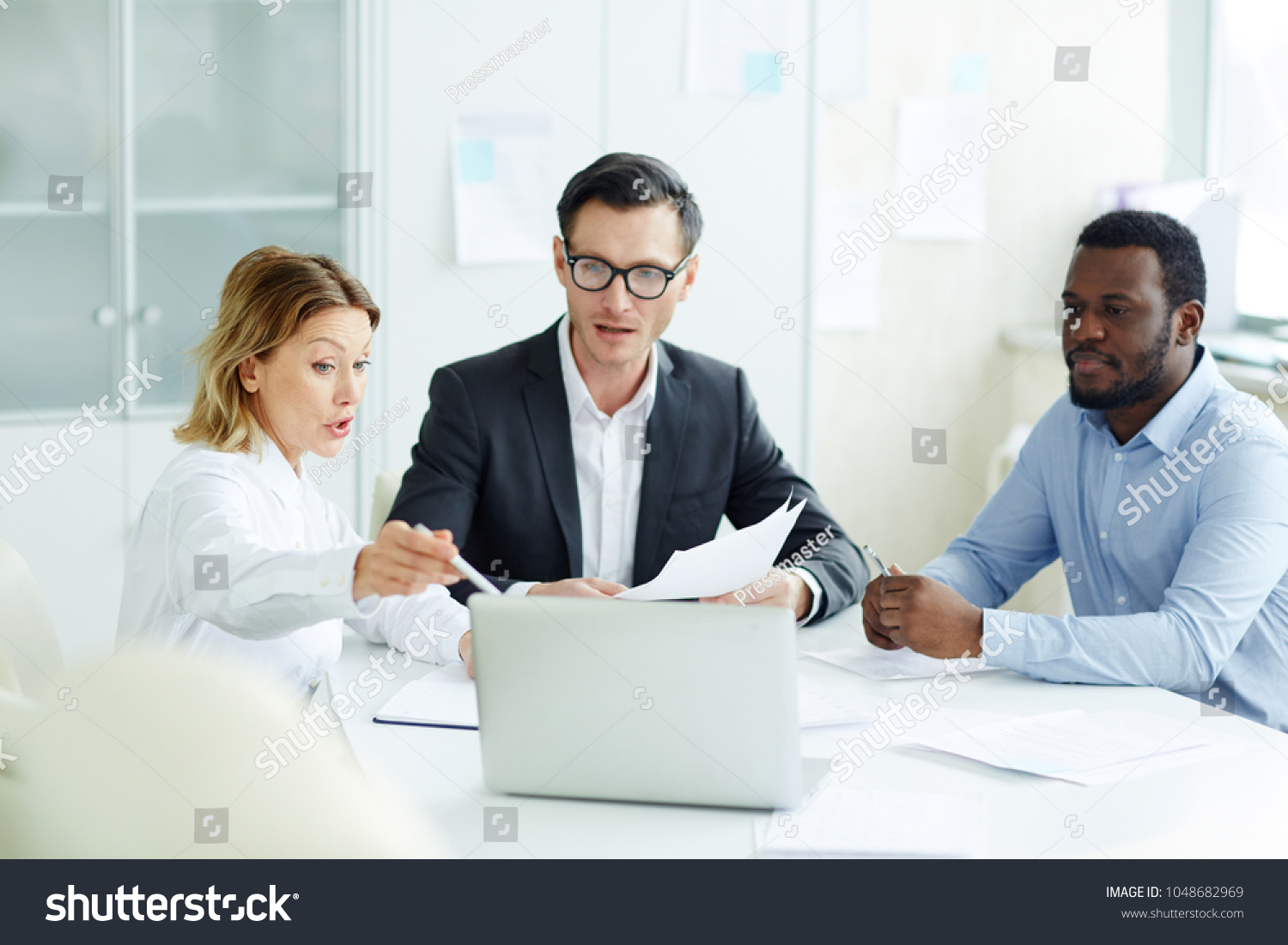 Confident Businesswoman Pointing Laptop Display Explaining Stock Photo