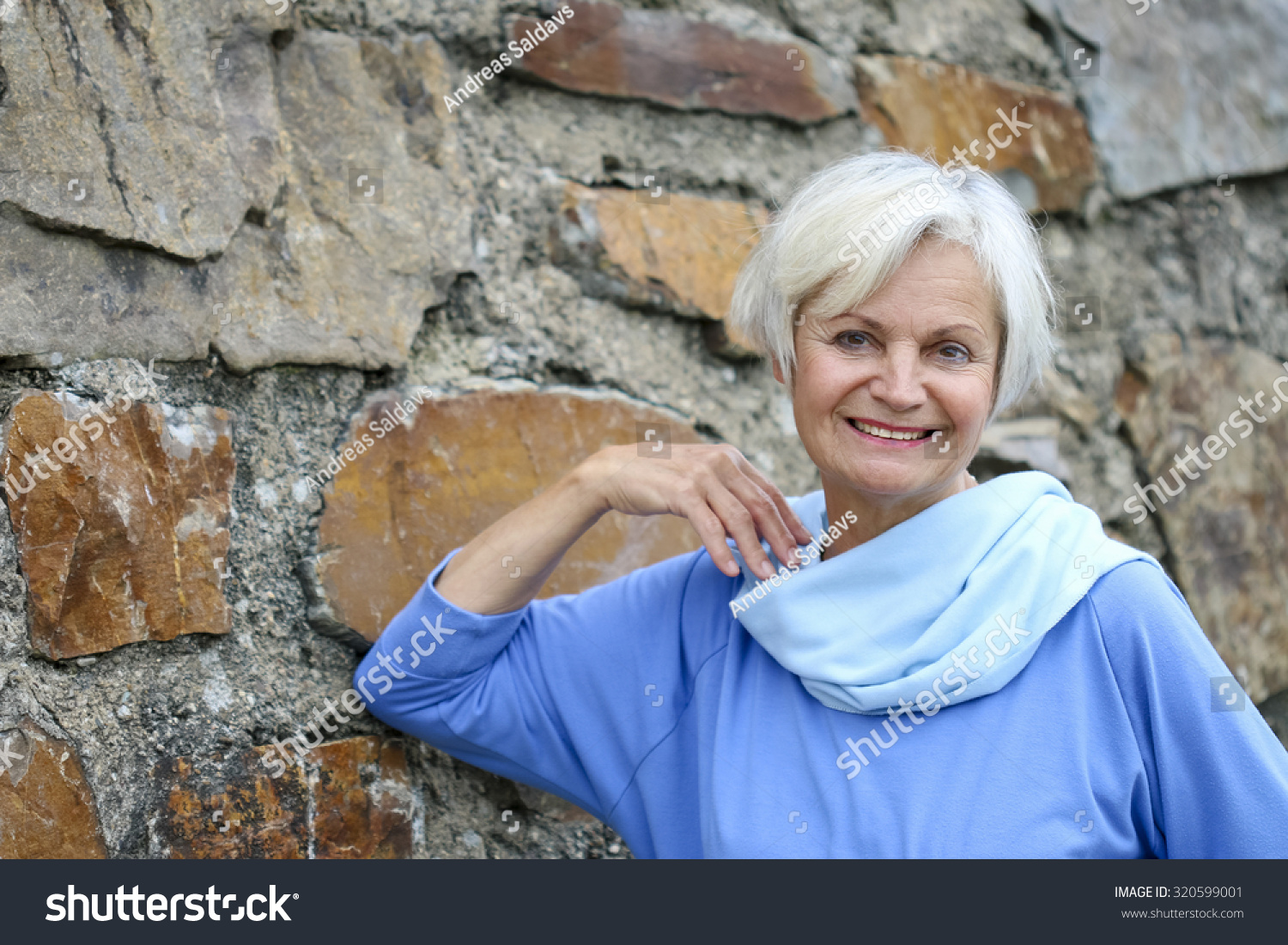 Confident Natural Senior Women Posing At Brick Wall Stock Photo ...