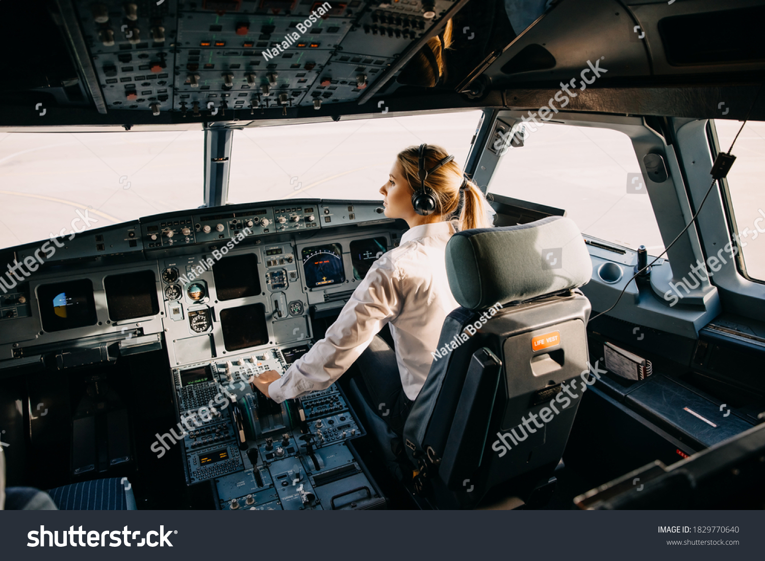 Confident Woman Pilot Flying Commercial Aircraft Stock Photo 1829770640 ...