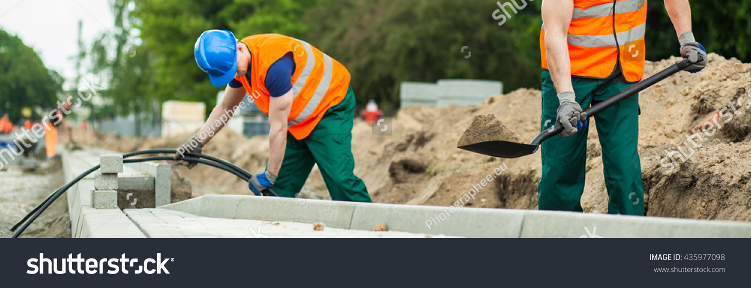 Construction Workers Digging Sand Stock Photo (Edit Now) 435977098