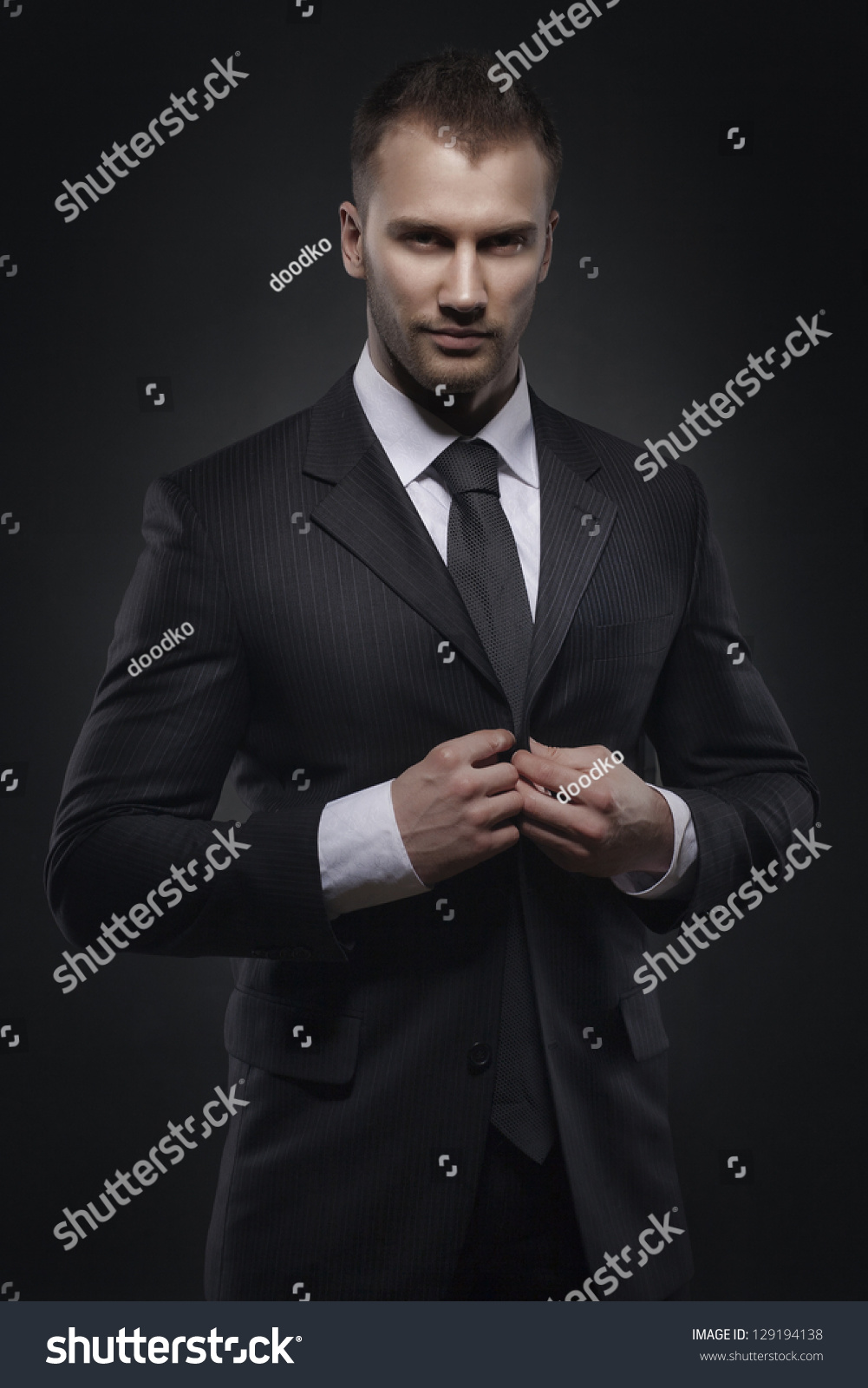 Cool Businessman Standing On Dark Gradient Background Stock Photo ...