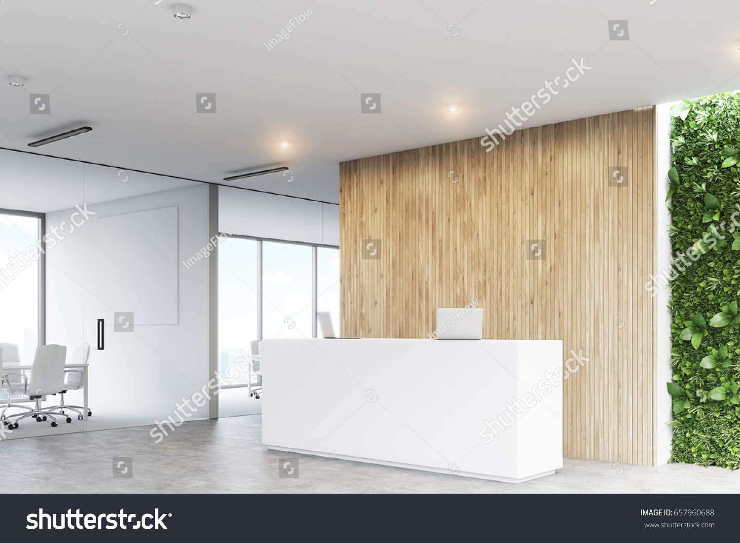 Corner Of A White Reception Desk With Two Laptops Standing On It In Front Corner Of A White Reception Desk With Two Laptops Standing On It In Front