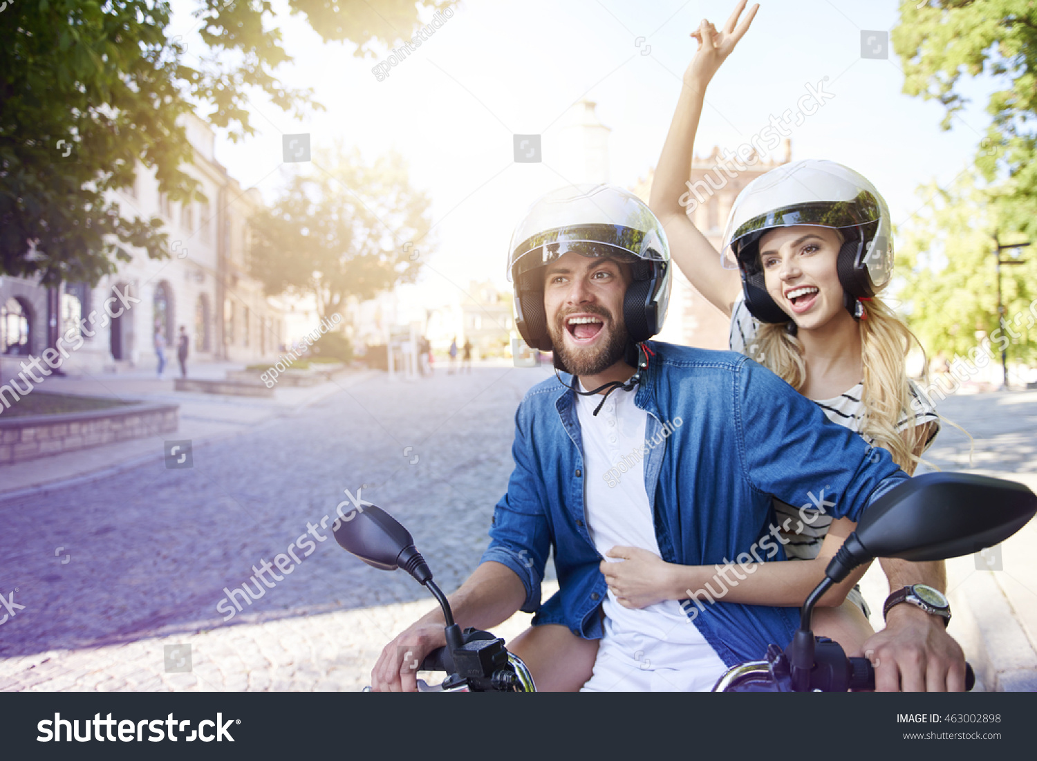 Couple Riding A Motorbike Wearing Helmets Stock Photo 463002898 ...