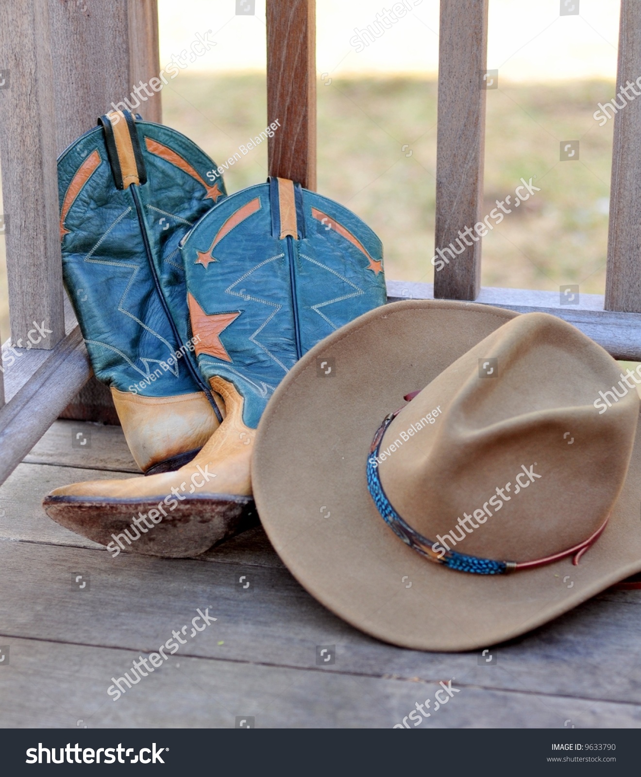 Cowboy Hat And Boots Leaning Against Railing Stock Photo 9633790 ...