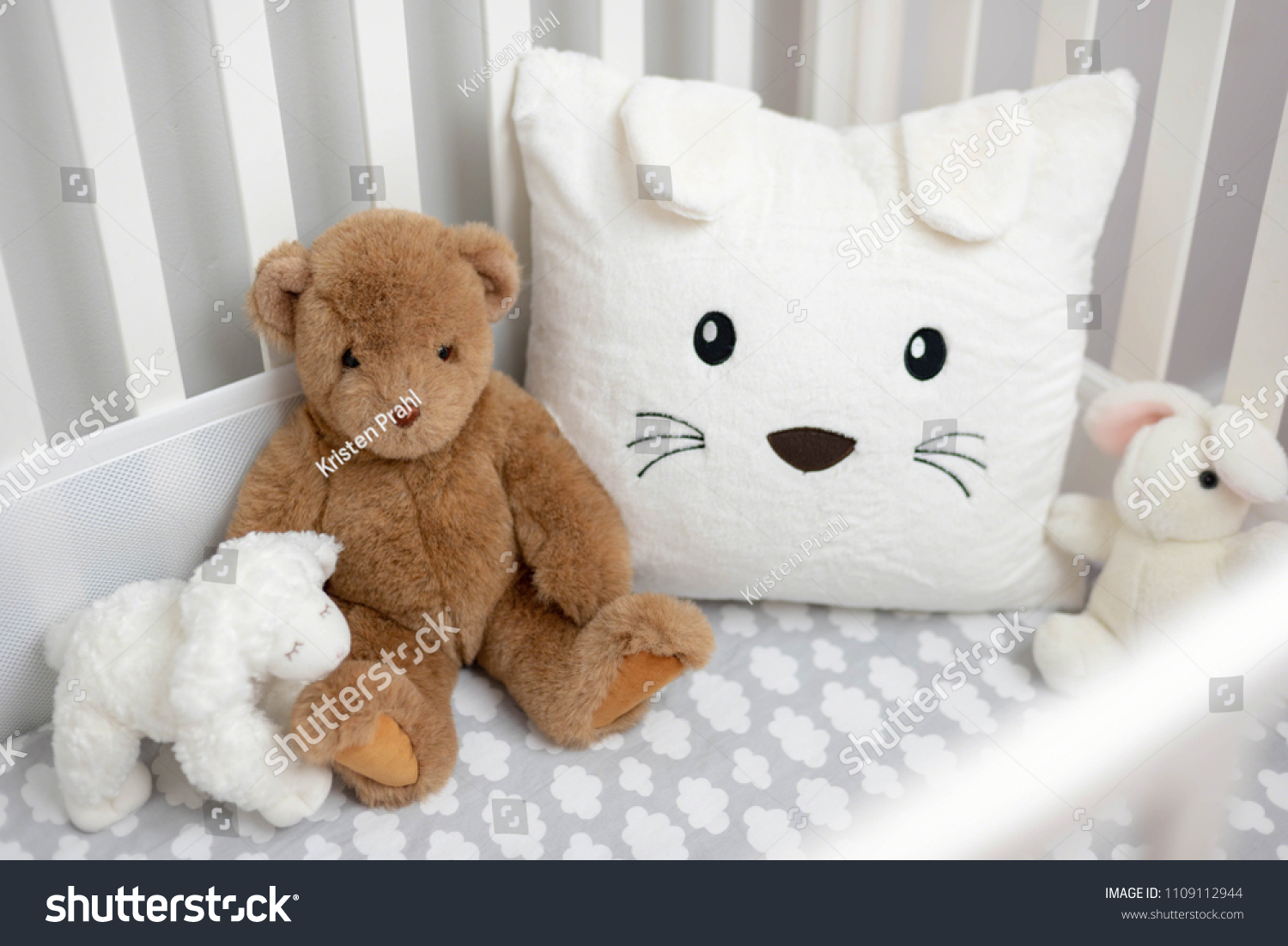 stuffed animals in crib