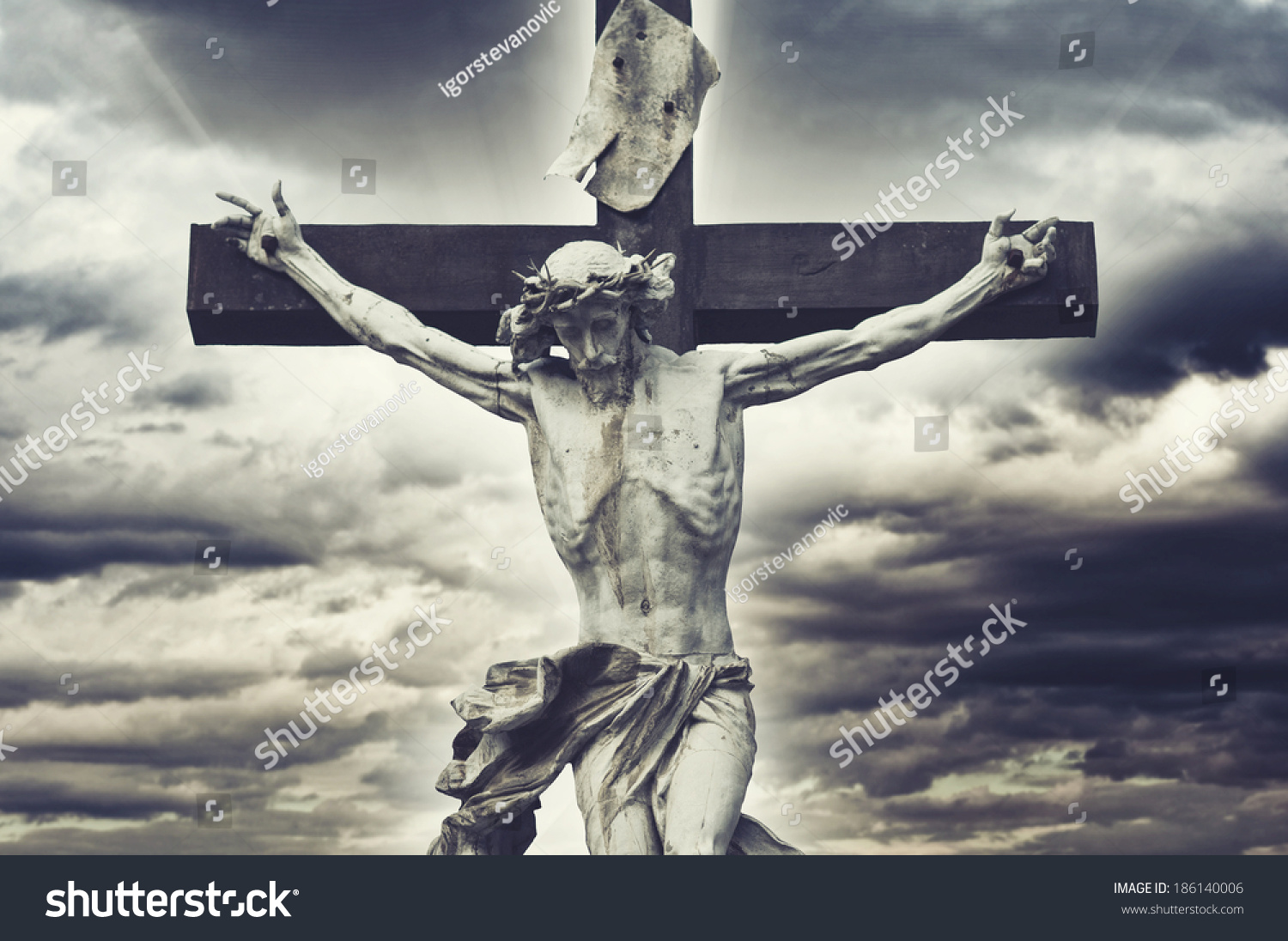 Crucifixion. Christian Cross With Jesus Christ Statue Over Stormy ...