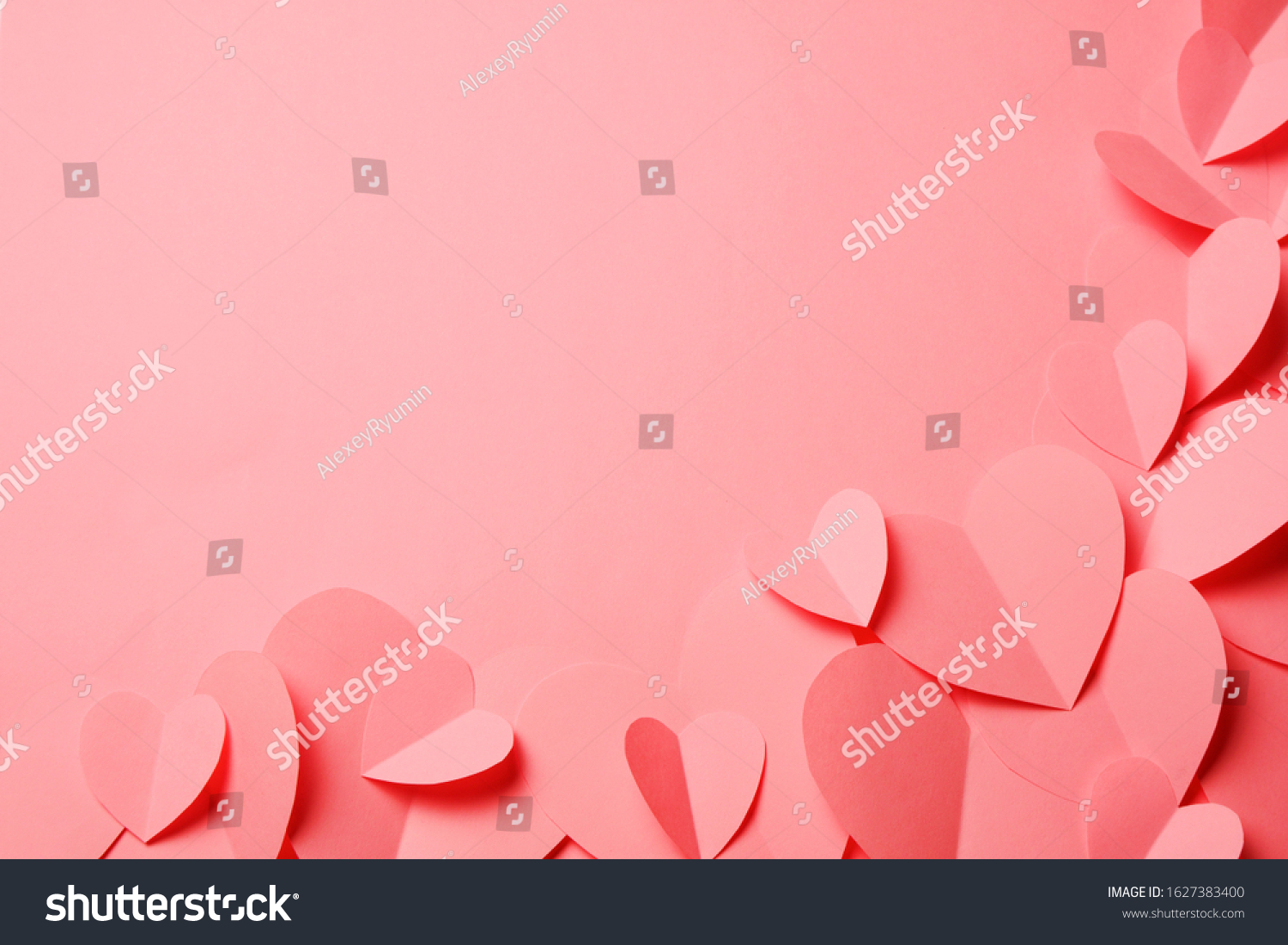 Cut out of pink paper hearts on pink background. Good Valentines day, Womans day, love, romantic or wedding composition with copy space for your text for banner, congratulation, card, offer, flyer, advertising, invitation.