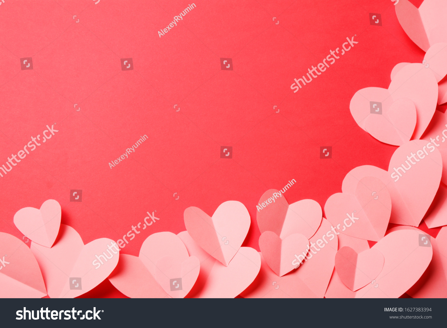 Cut out of pink paper hearts on red background. Good Valentines day, Womans day, love, romantic or wedding composition with copy space for your text for banner, congratulation, card, offer, flyer, advertising, invitation.