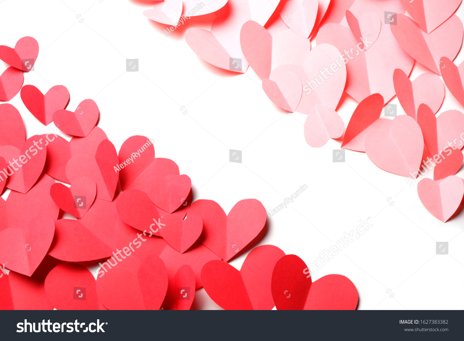 Cut out of red and pink paper hearts on red background isolated. Beautiful Valentines day, Womans day, love, romantic or wedding composition with copy space for your text  for banner, congratulation, card, offer, flyer, advertising, invitation.