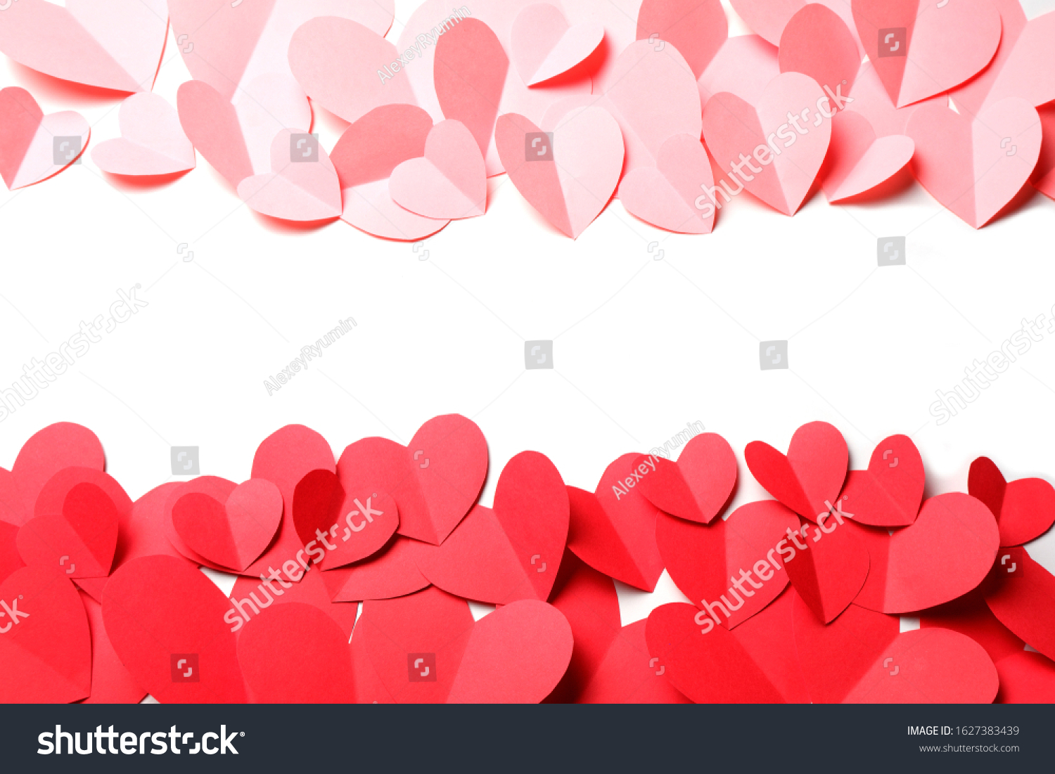 Cut out of red and pink paper hearts on red background isolated. Beautiful Valentines day, Womans day, love, romantic or wedding composition with empty space for custom text for banner, congratulation, card, offer, flyer, advertising, invitation.