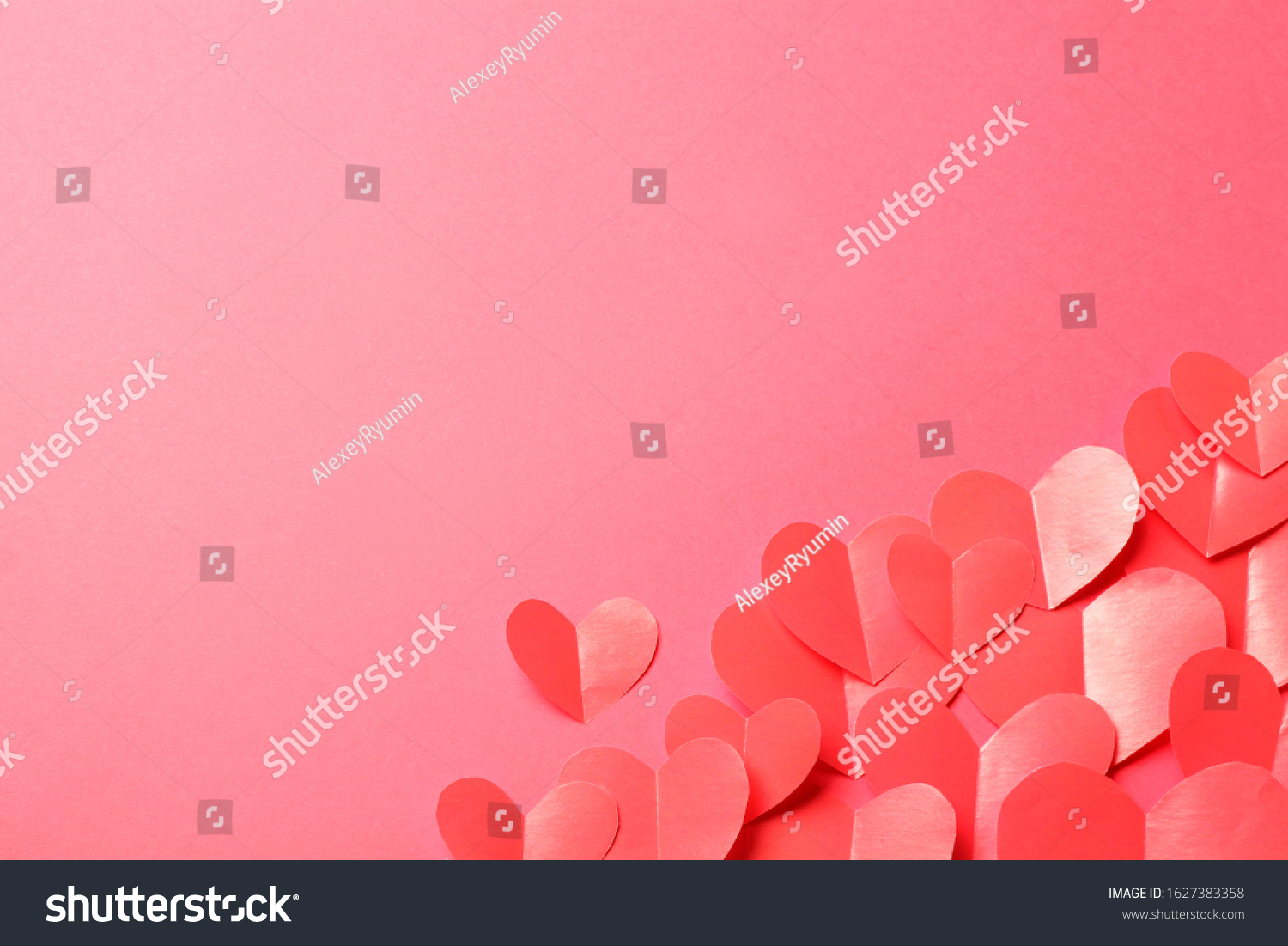 Cut out of red paper hearts on pink background. Good Valentines day, Womans day, love, romantic or wedding composition with empty space for custom text for banner, congratulation, card, offer, flyer, advertising, invitation.