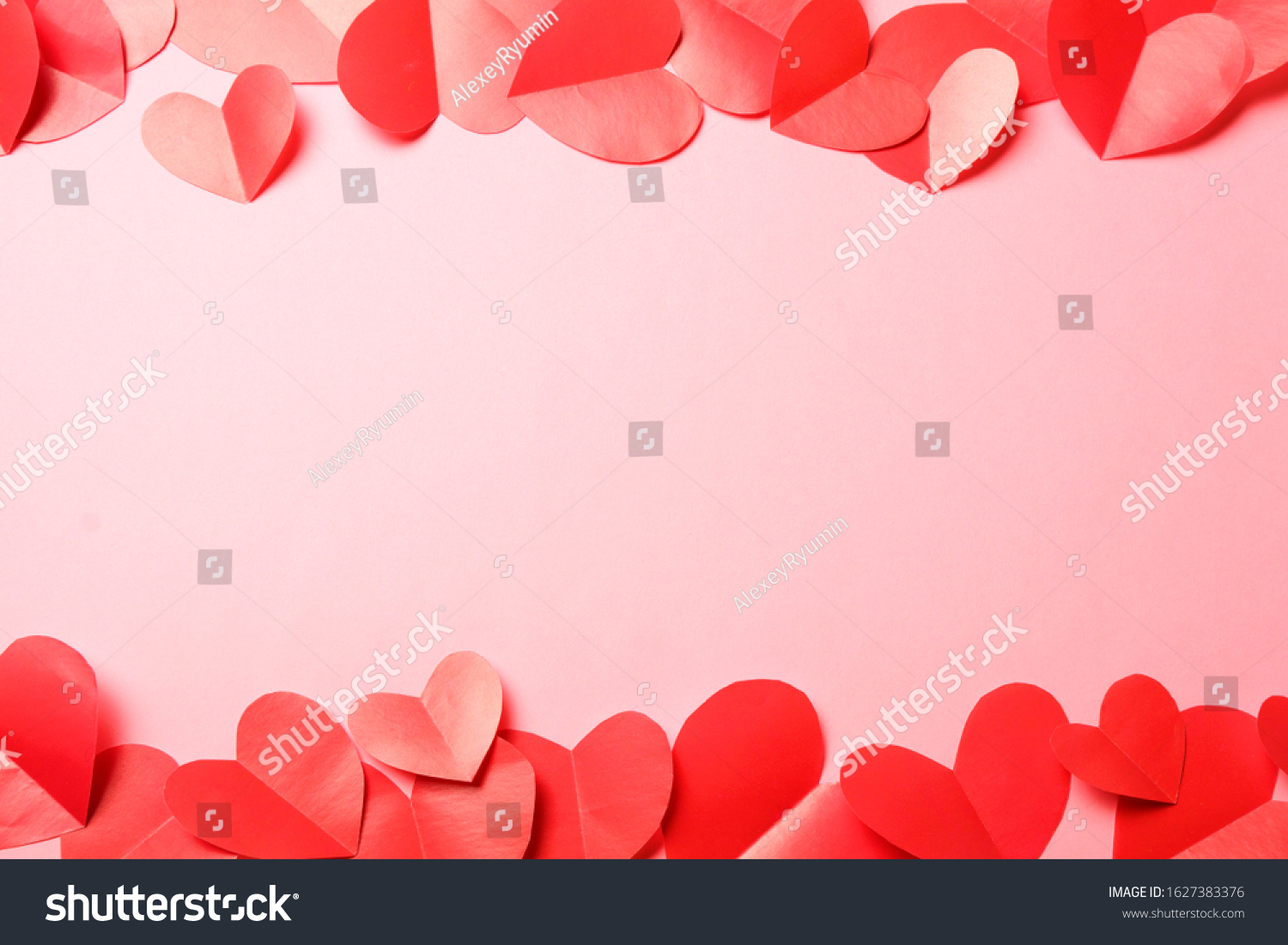 Cut out of red paper hearts on pink background. Good Valentines day, Womans day, love, romantic or wedding composition with free space for custom text for banner, congratulation, card, offer, flyer, advertising, invitation.