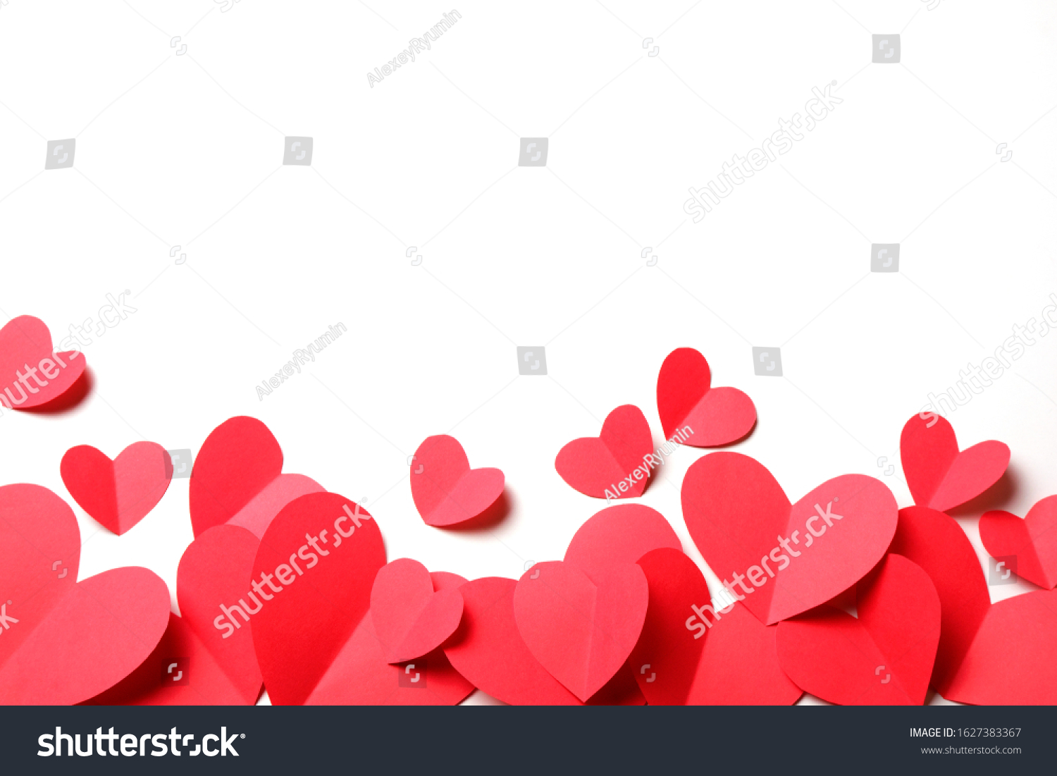 Cut out of red paper hearts on white background isolated. Cute Valentines day, Womans day, love, romantic or wedding composition with copy space for your text for banner, congratulation, card, offer, flyer, advertising, invitation.