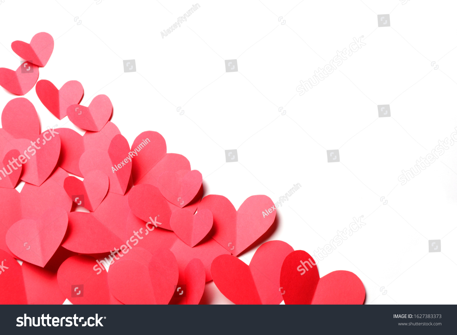 Cut out of red paper hearts on white background isolated. Cute Valentines day, Womans day, love, romantic or wedding composition with copy space for your text for banner, congratulation, card, offer, flyer, advertising, invitation.