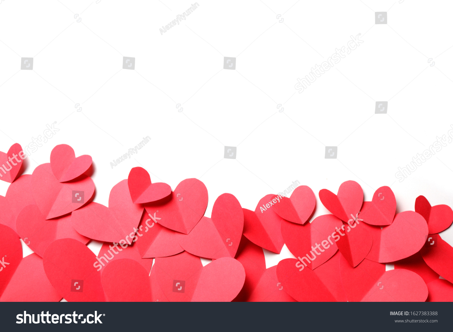 Cut out of red paper hearts on white background isolated. Cute Valentines day, Womans day, love, romantic or wedding composition with copy space for your text  for banner, congratulation, card, offer, flyer, advertising, invitation.