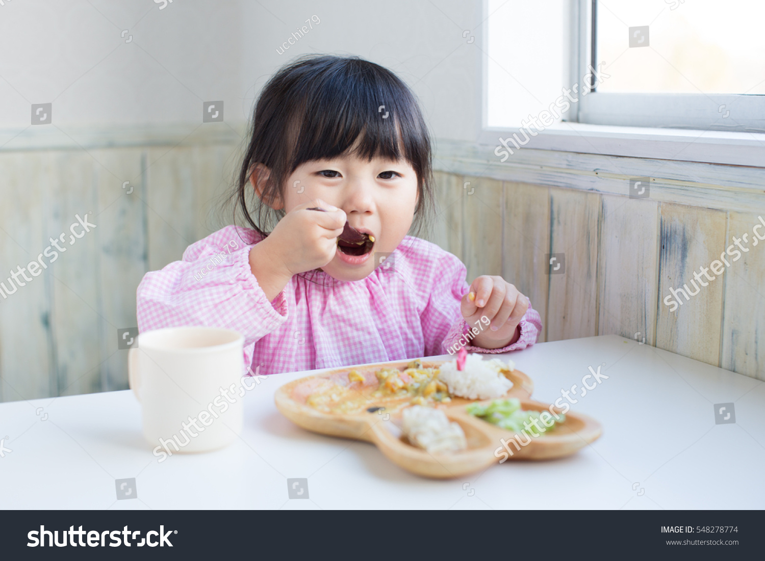 Cute Asian Girl Eating Lunch At Kindergarten. Stock Photo 548278774 ...