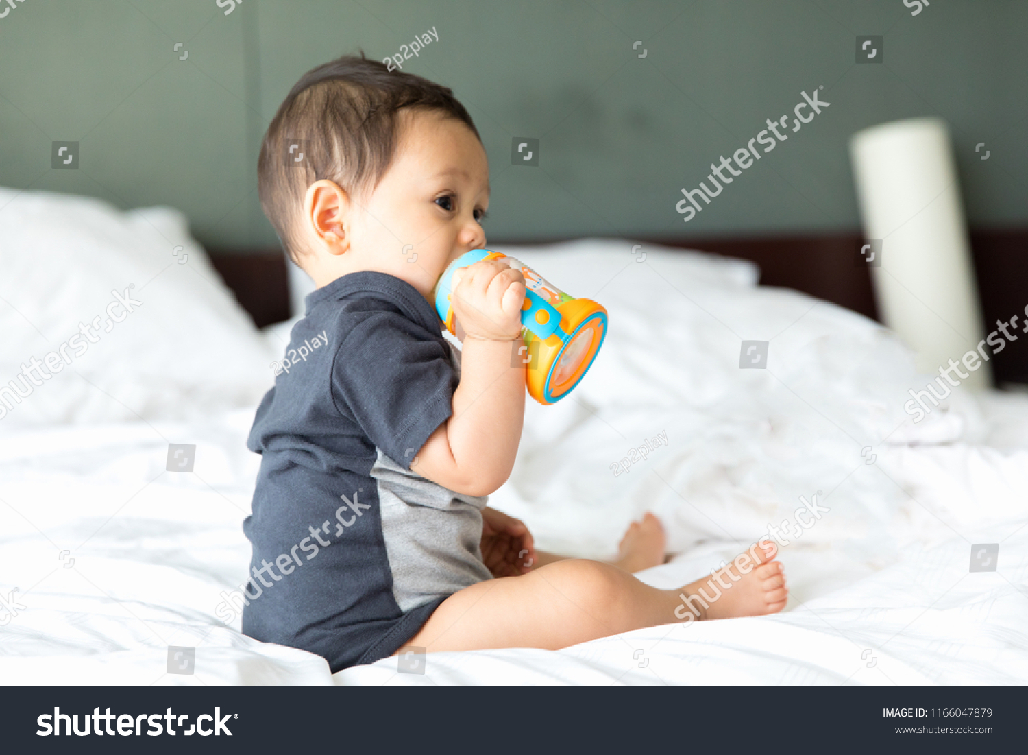 Cute Baby Boy Eating Milk Bottle Stock Photo Edit Now 1166047879