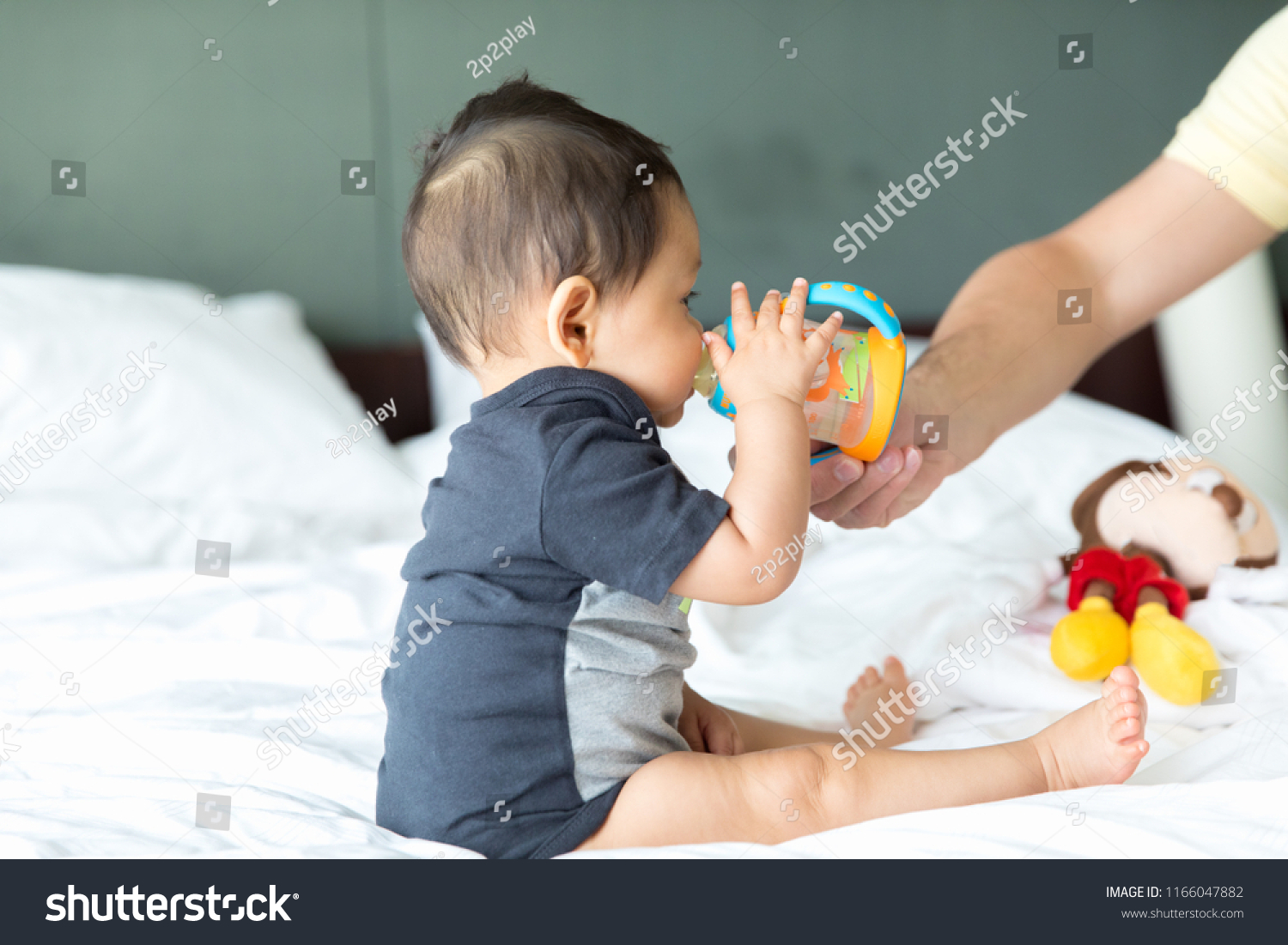 Cute Baby Boy Eating Milk Bottle Stock Photo Edit Now 1166047882