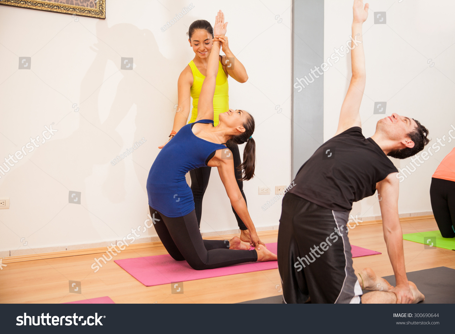 Cute Female Yoga Instructor Helping Student Stock Photo Edit Now