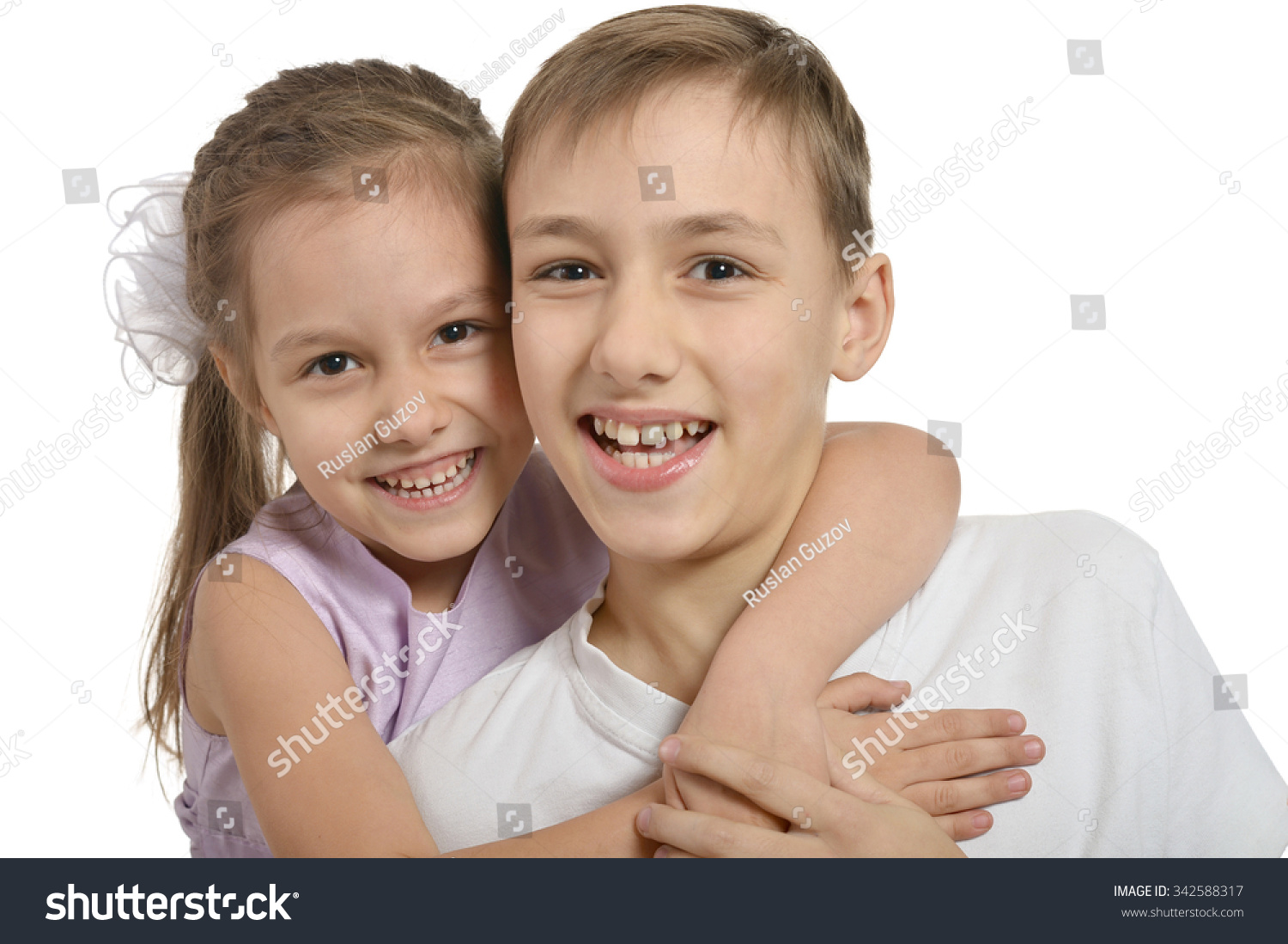 Cute Little Brother And Sister Hugging On White Background Stock Photo ...