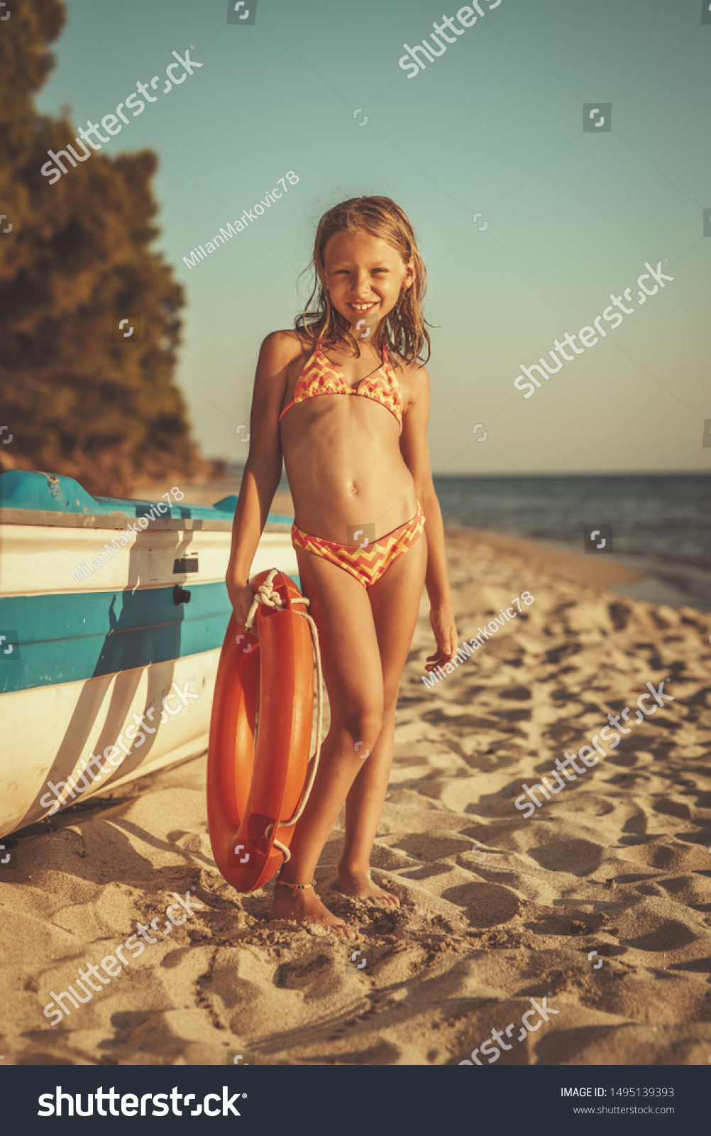 Cute Little Girl Relaxing On Beach Stock Photo Edit Now