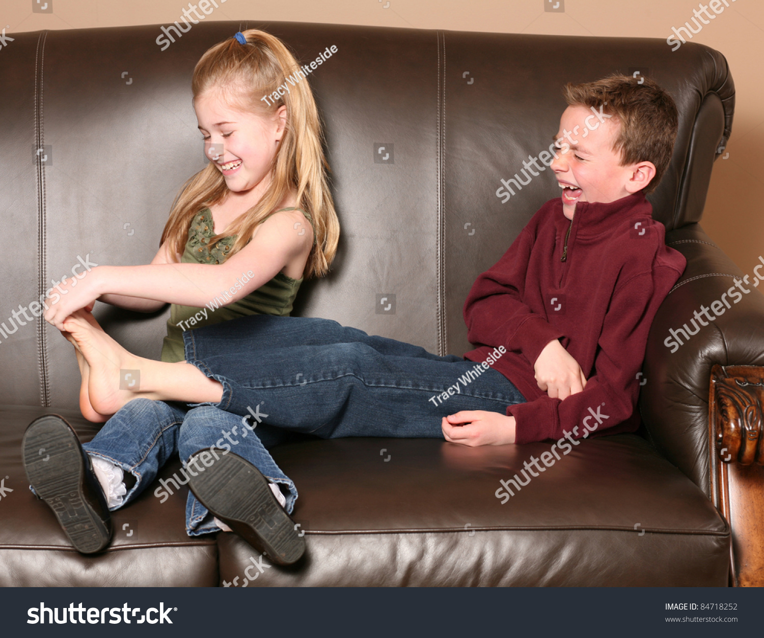 Cute Little Girl Tickling Brothers Feet Stock Photo 84718252 Shutterstock