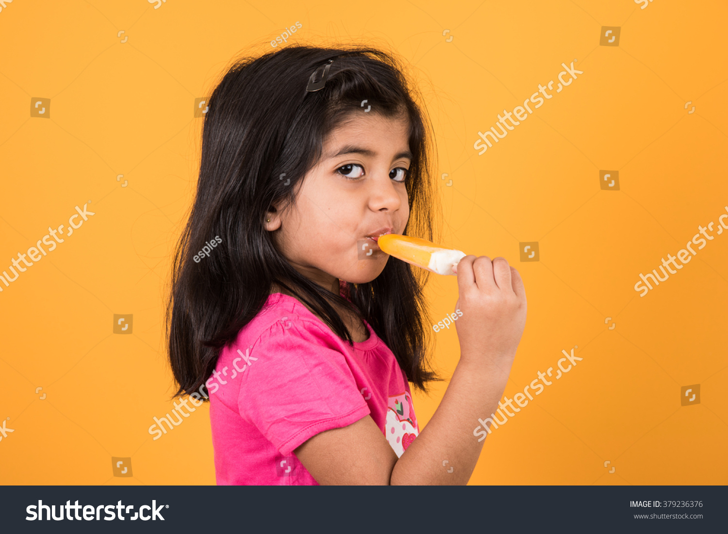 Cute Little Indianasian Girl Eating Ice Stock Photo Edit Now