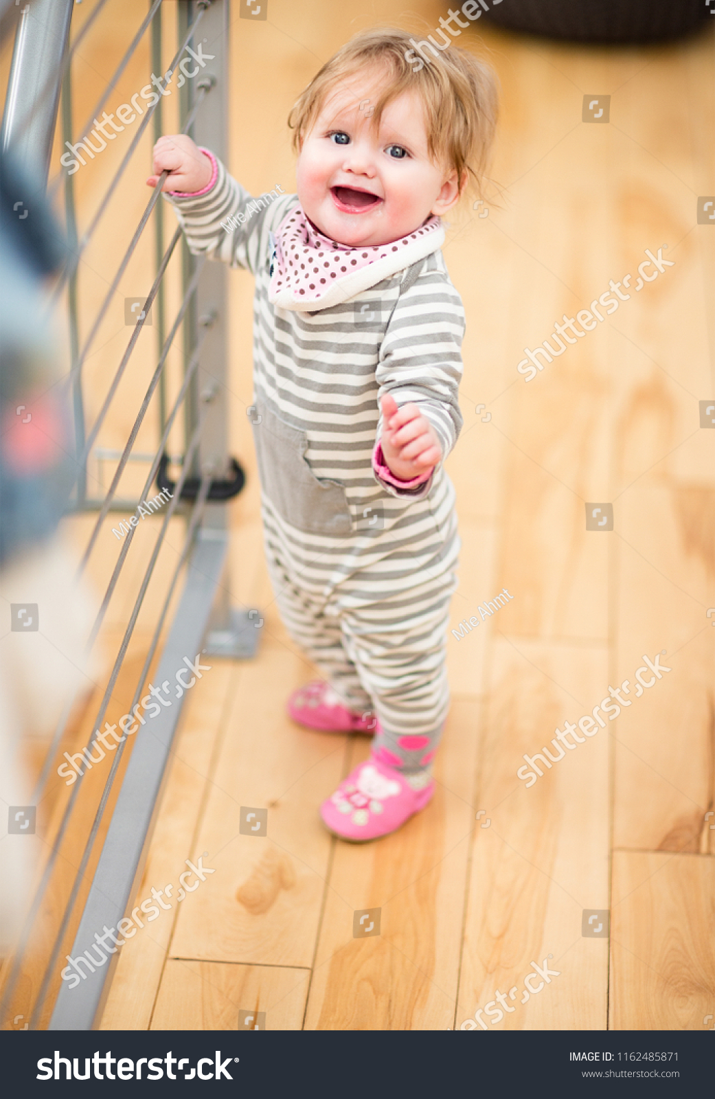 8 month old baby standing