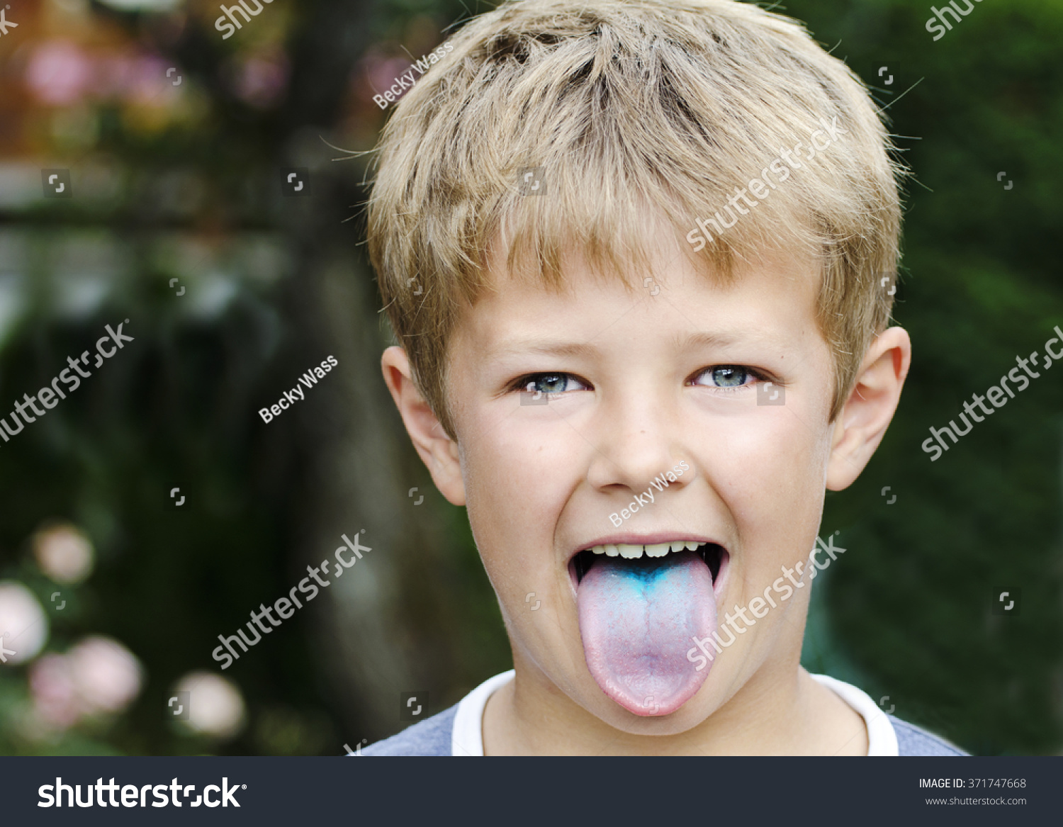 cute-young-boy-sticking-out-his-stock-photo-371747668-shutterstock