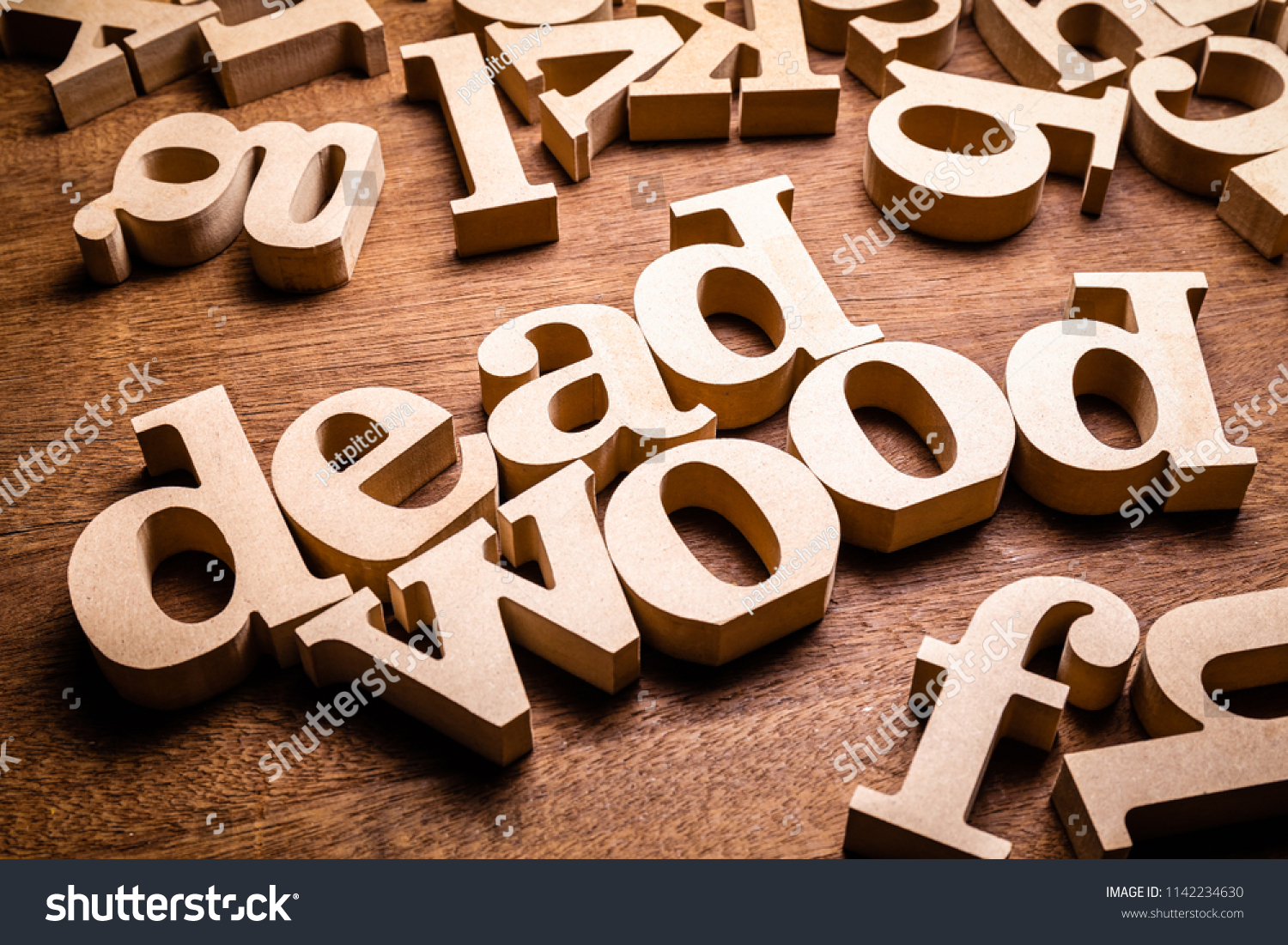 deadwood-word-scattered-letters-metaphor-worthless-stock-photo