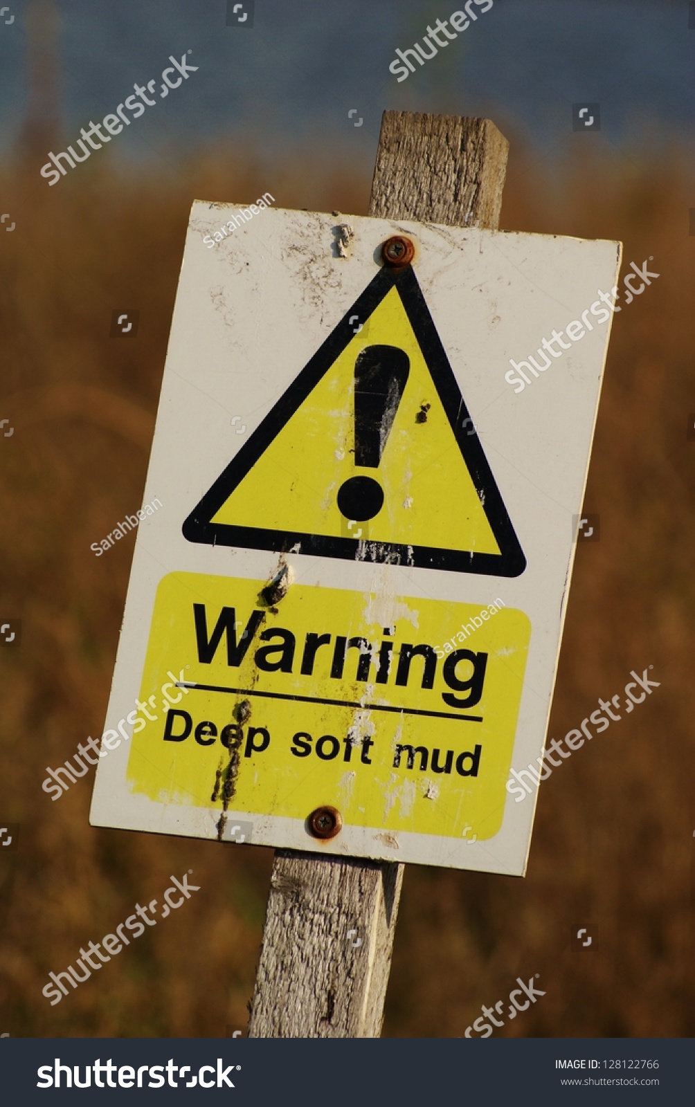 Deep Mud Sign Against Background Of Long Grass And Reeds Stock Photo ...