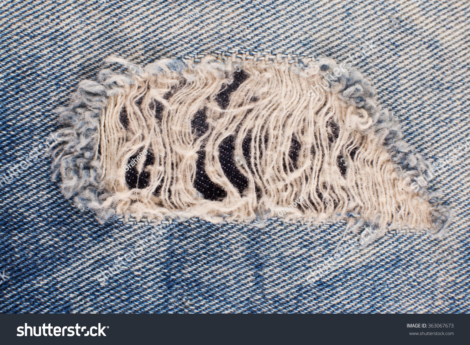 Denim Texture. A Fragment Of Blue Jeans. Holey Jeans. Ripped Jeans, A ...