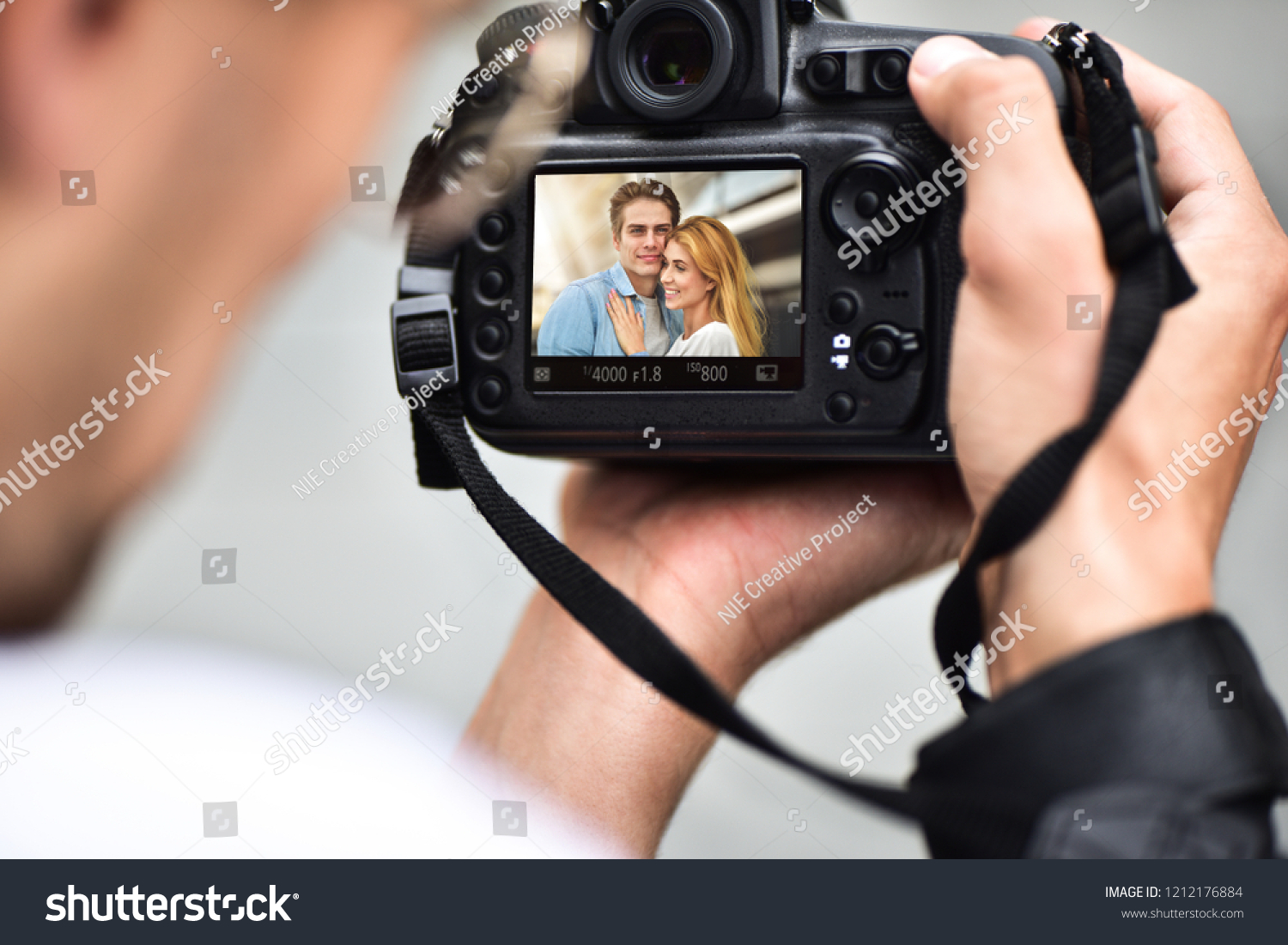 Shooting Digital Photographs Through >> Digital Singlelens Reflex Camera Hands Photographer Stock Photo Shooting Digital Photographs Through >> Digital Singlelens Reflex Camera Hands Photographer Stock Photo