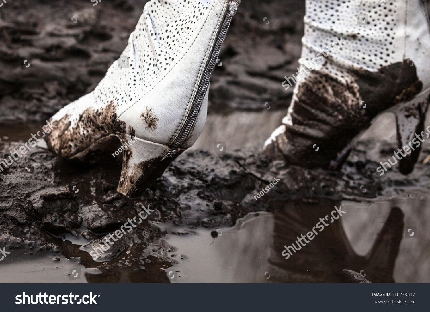 muddy high heel boots