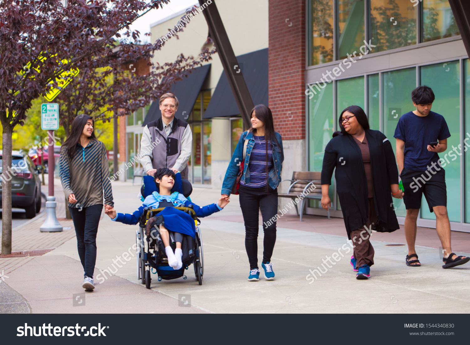 Foto Stok Disabled Biracial Boy Wheelchair Walking Along (Edit Sekarang ...