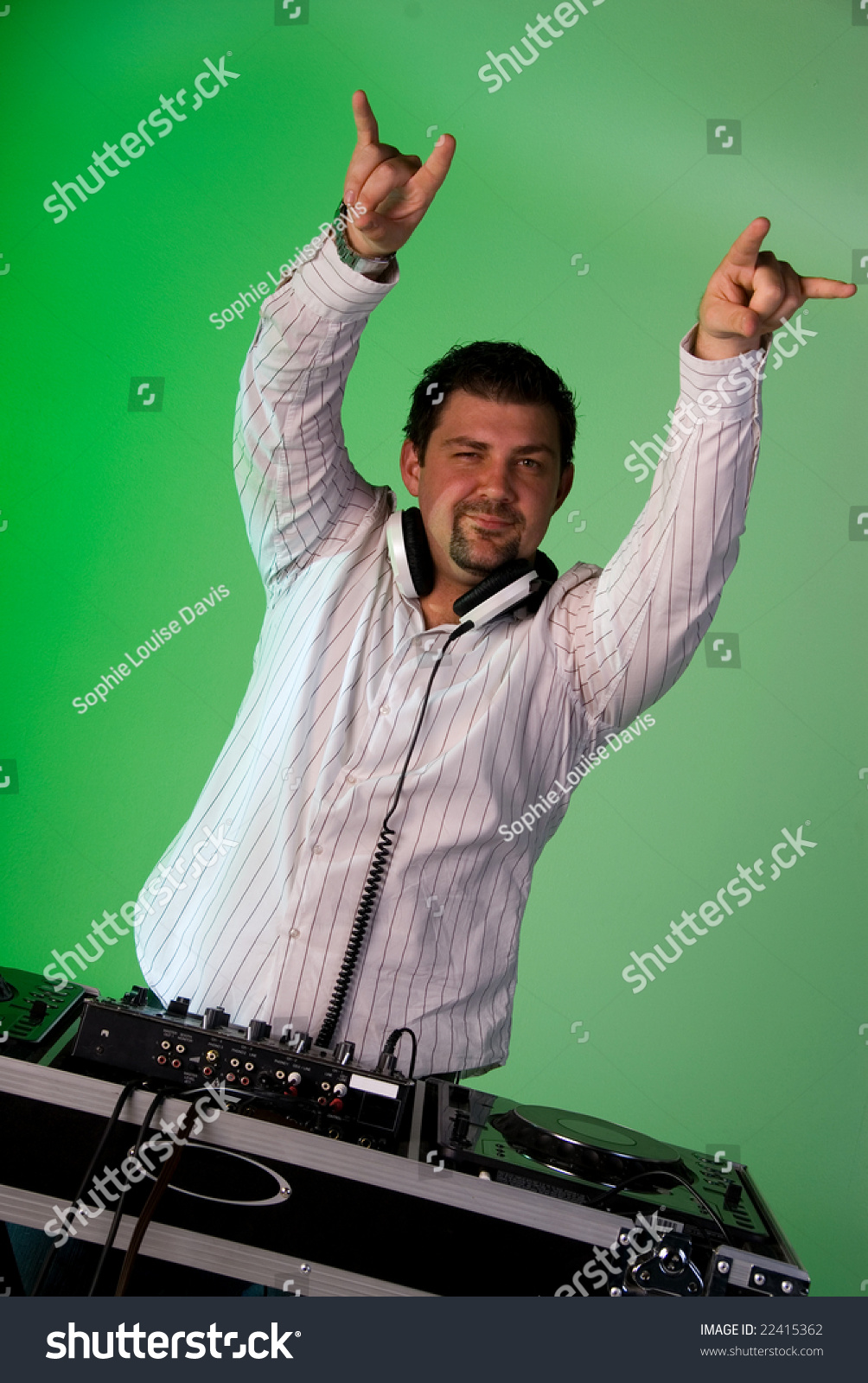 Dj Behind The Mixing Deck, Pointing In The Air With Both Hands. Green ...