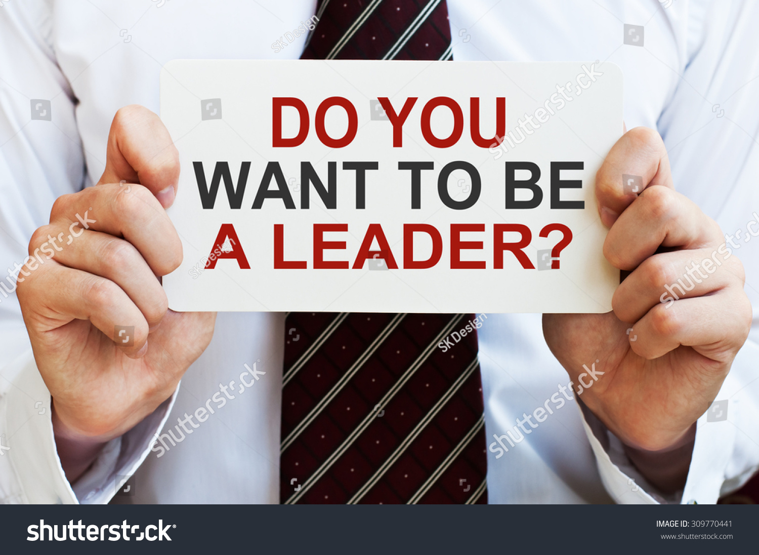 Do You Want To Be A Leader? Businessman Holding A Card With A Message ...