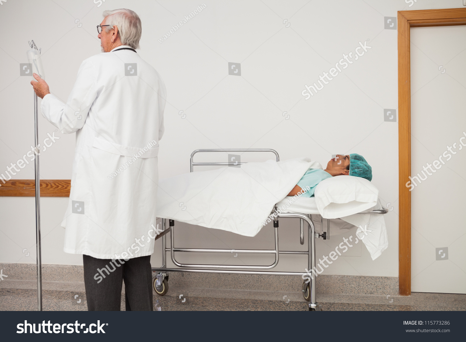 Doctor Adjusting Patients Iv Drip Hospital Stock Photo Edit Now 115773286