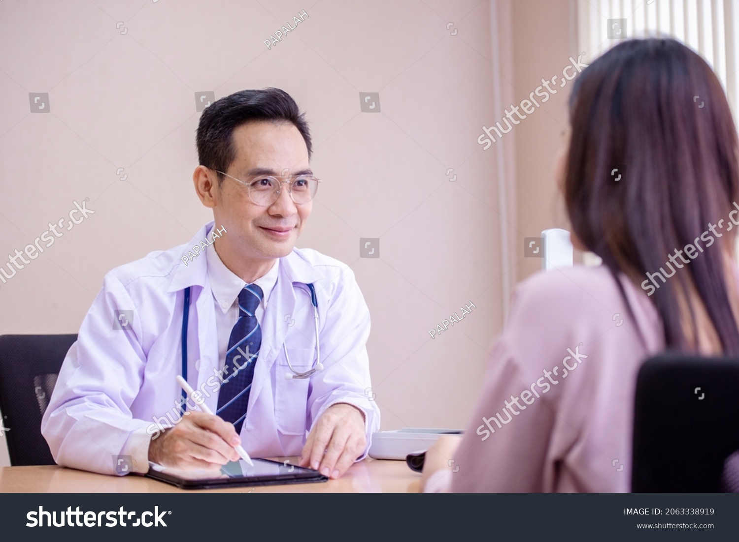 Doctor Asking Patient History Using Tablet Stock Photo 2063338919 ...