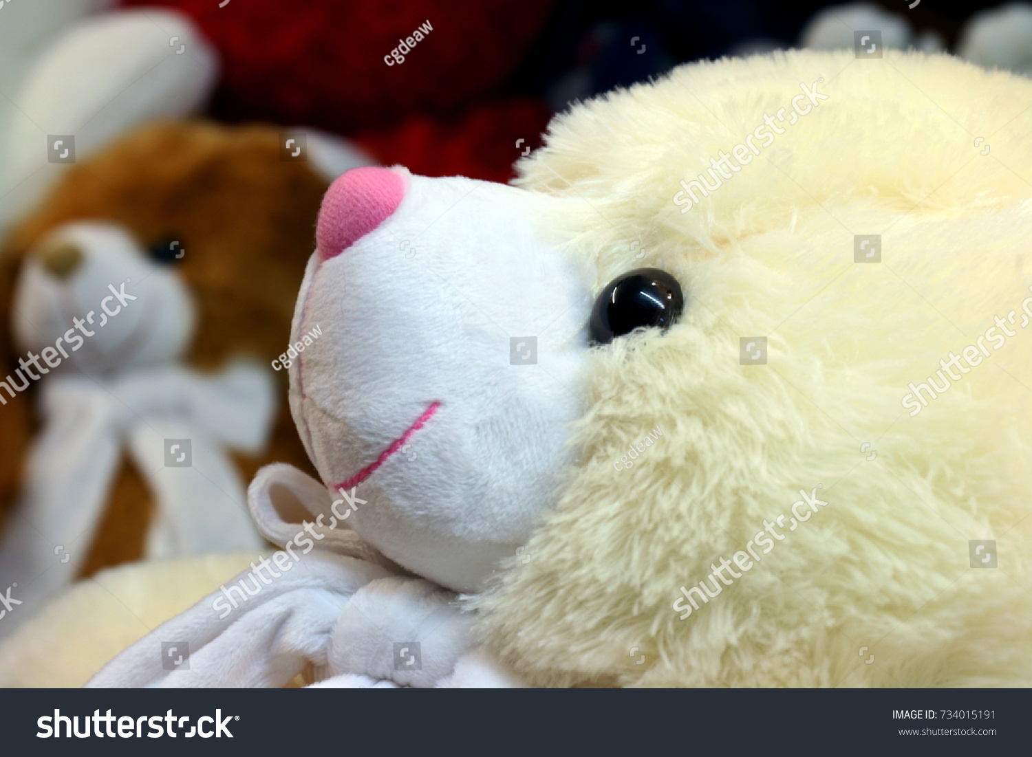 teddy bear with doll face