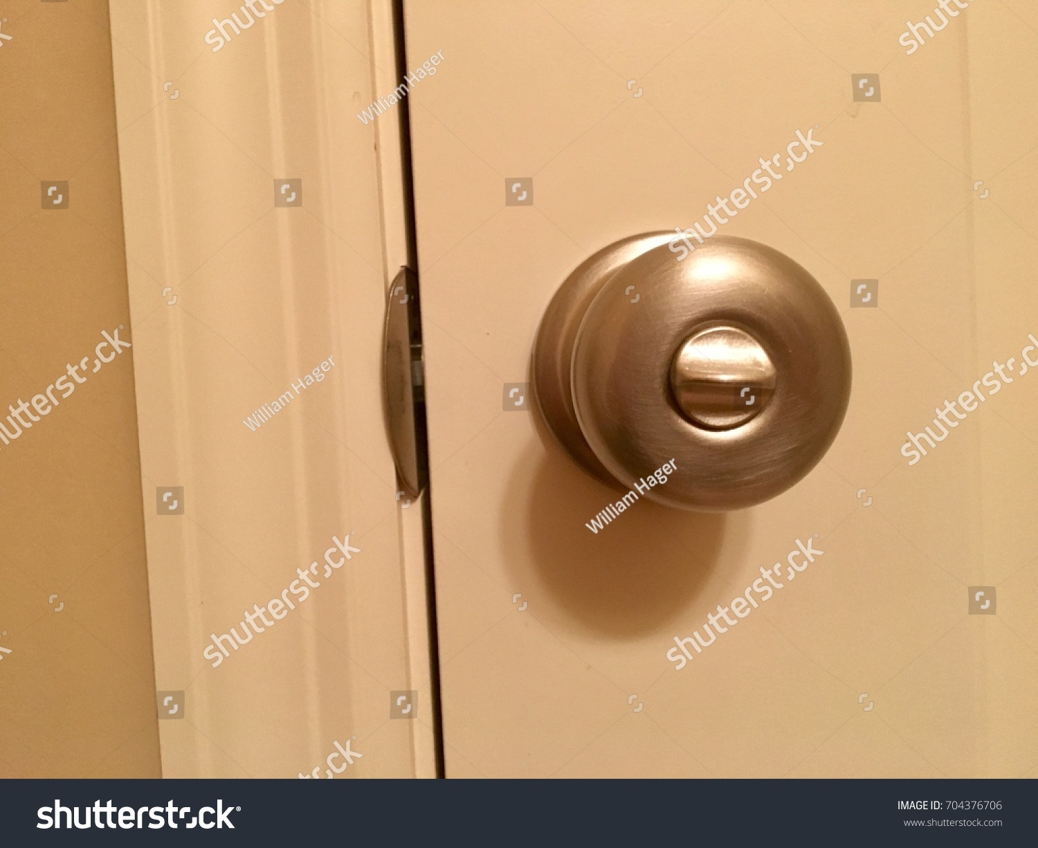 Door Knob Silver On White Door Stock Photo Edit Now 704376706